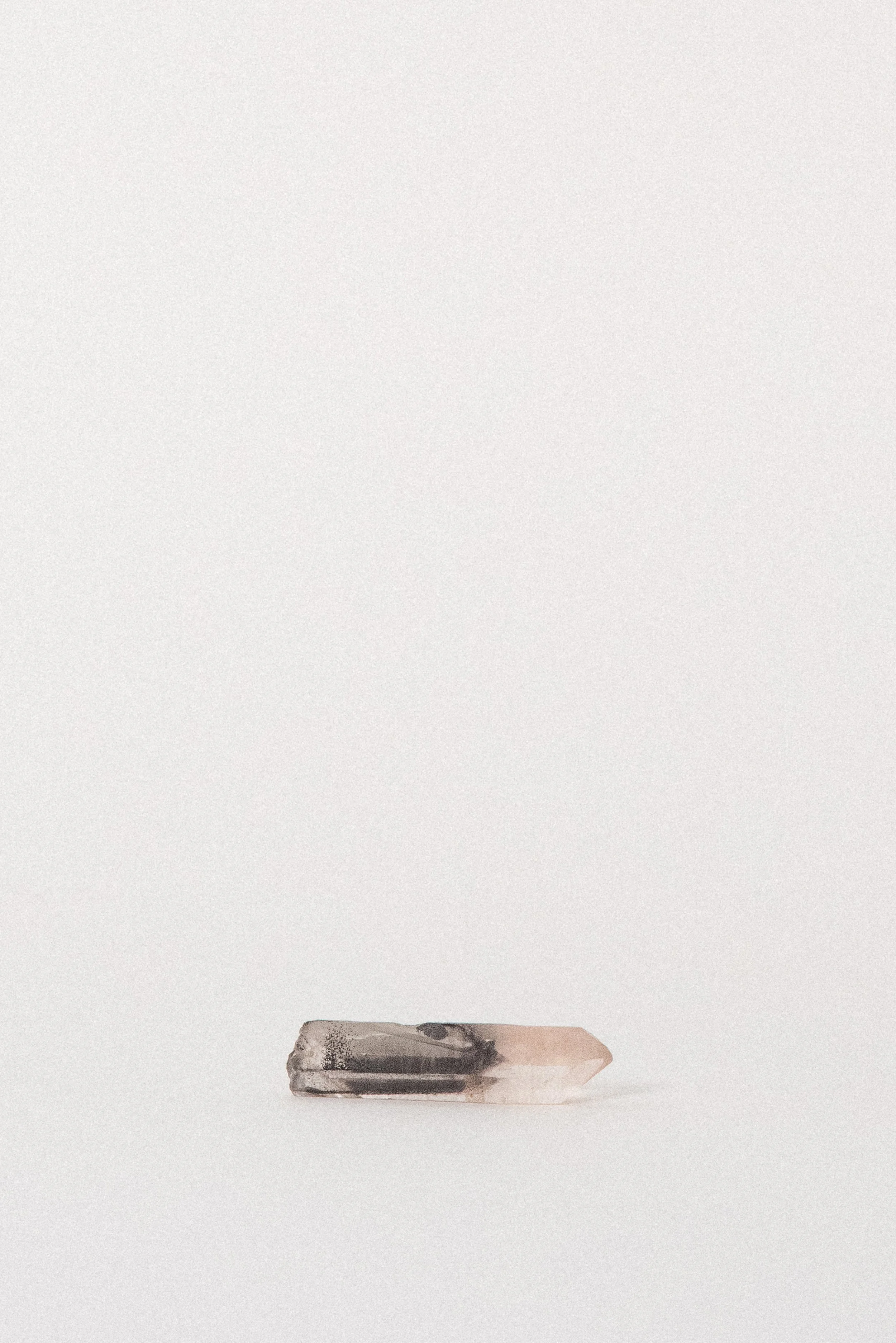 crystal-voyager-quartz-point-with-hematite-karur-india-1.jpg