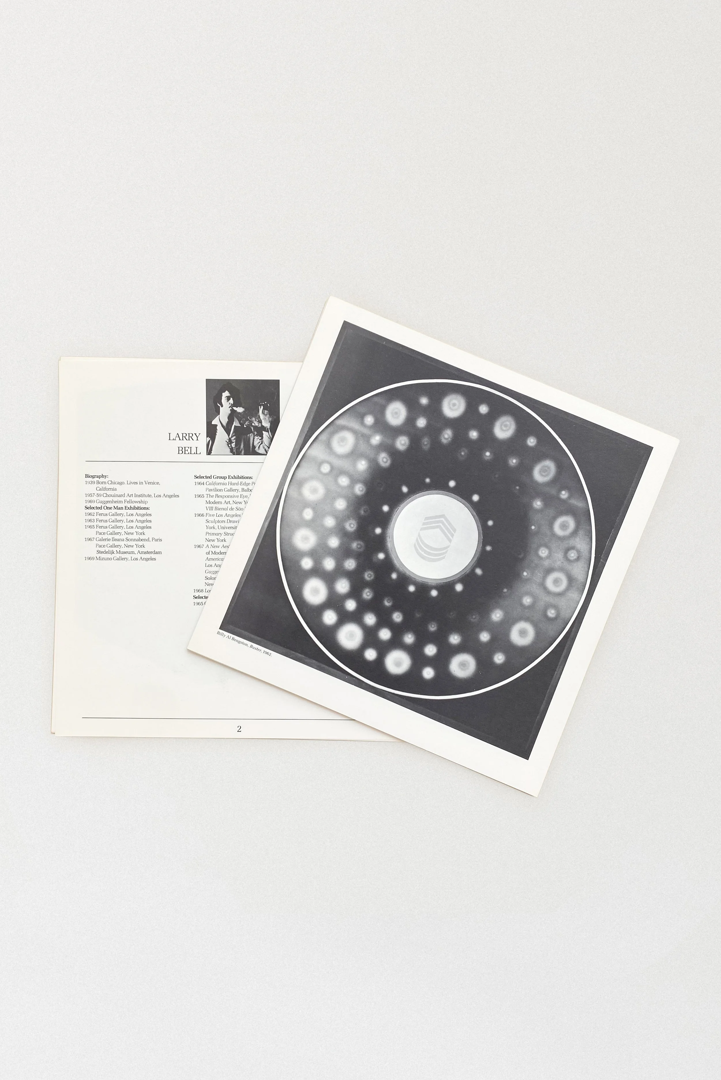 Interior portfolio plate from West Coast: 1945–1969 exhibition catalog, featuring a biographical profile and a black and white artwork by Larry Bell, published by the Pasadena Art Museum in 1969.
