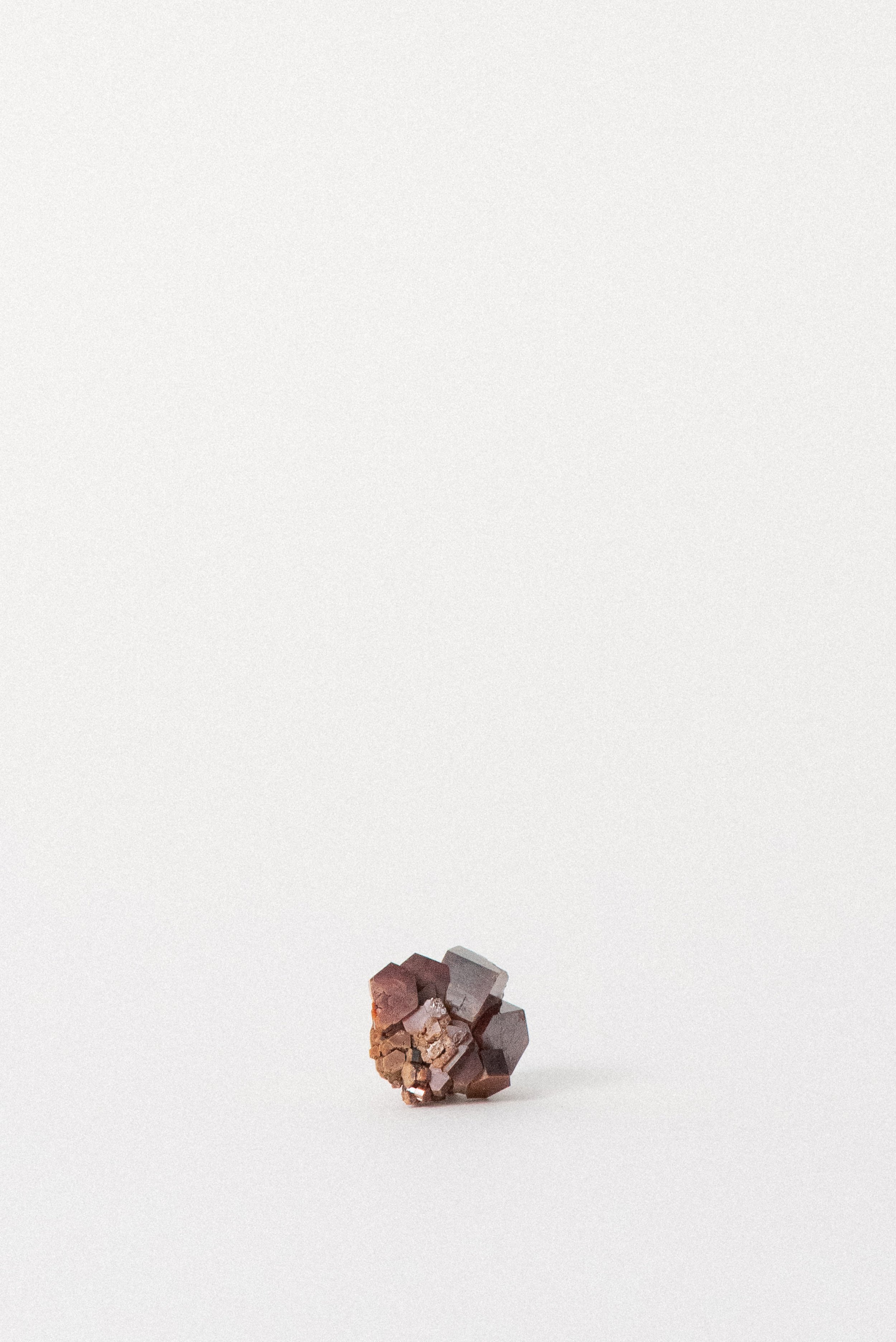 View showing deep red Vanadinite crystals with earthy matrix base.