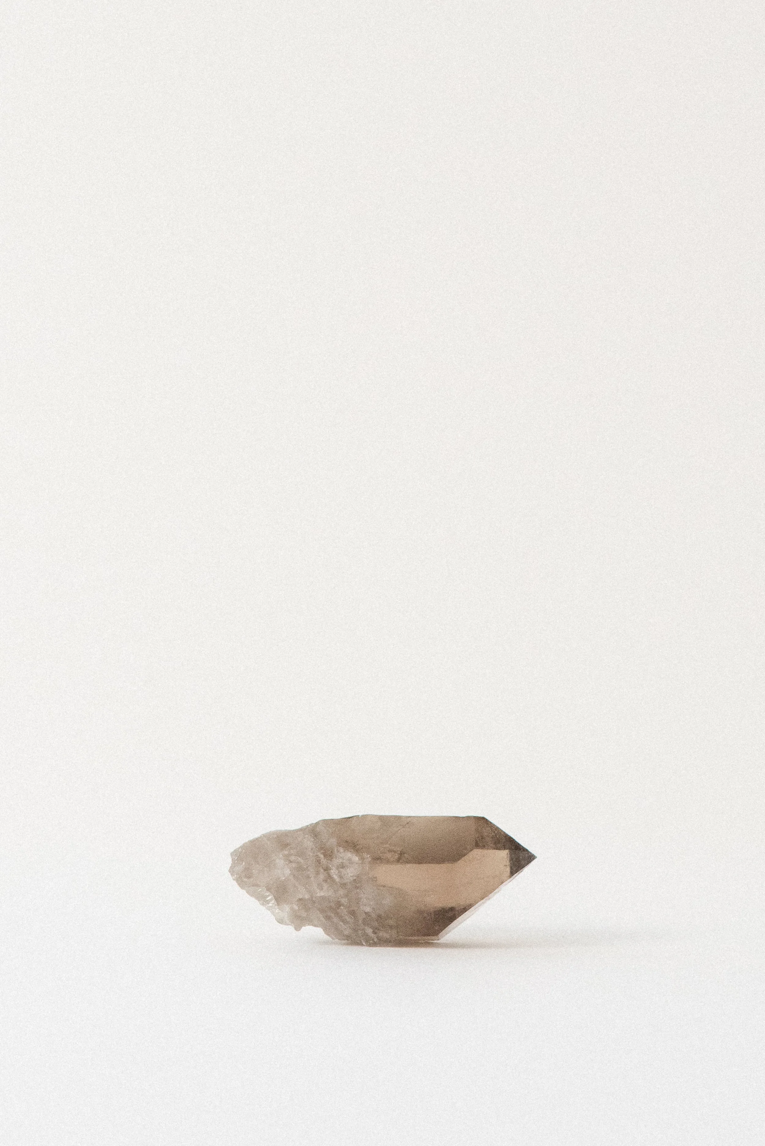 Smoky quartz point from Mont Blanc, L’Aiguille de Talèfre, Chamonix – alpine French crystal showing light-facing side with natural etching and translucent body