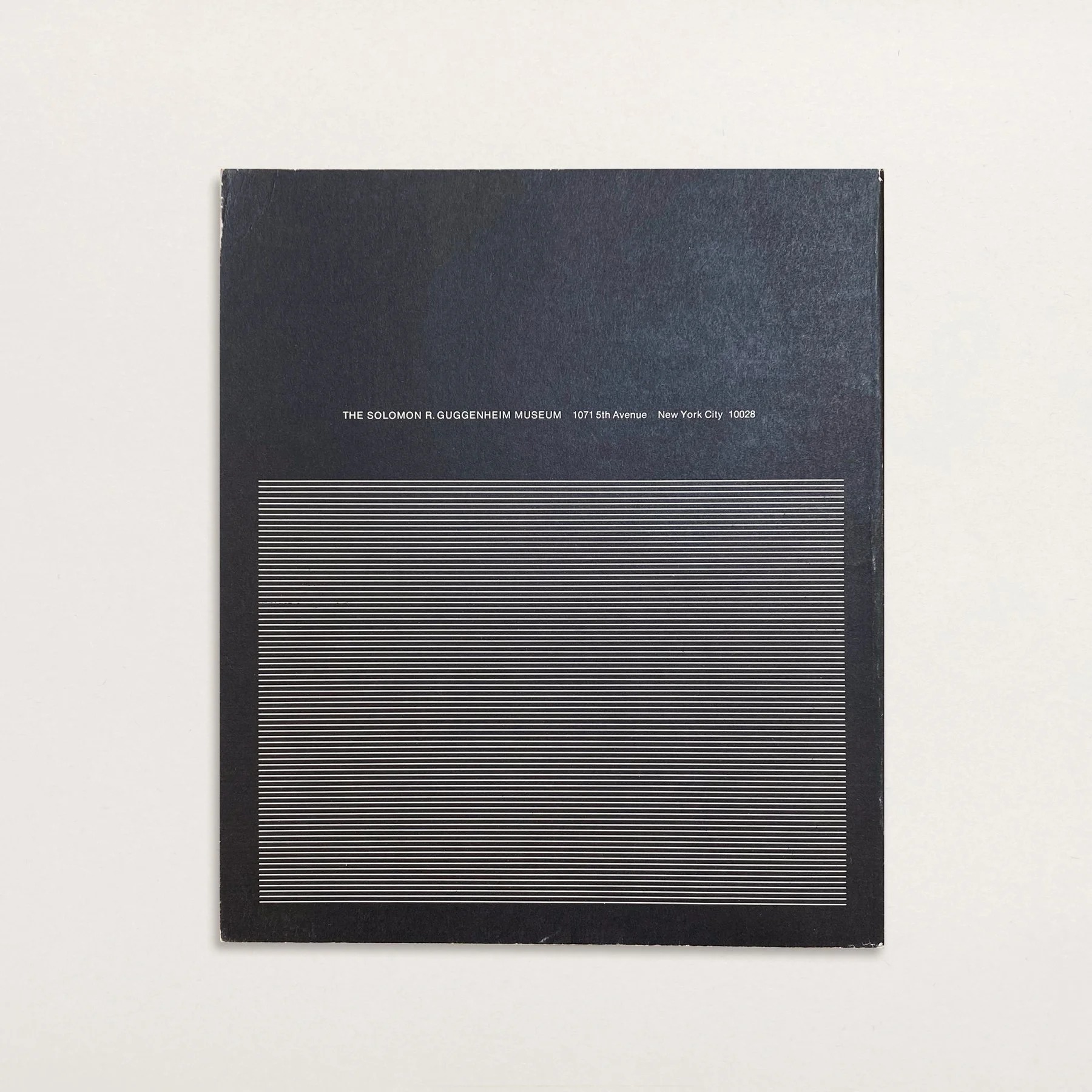 Back cover of SOTO: A Retrospective Exhibition (Guggenheim, 1974), featuring black background with white linear kinetic graphic and Guggenheim Museum imprint.