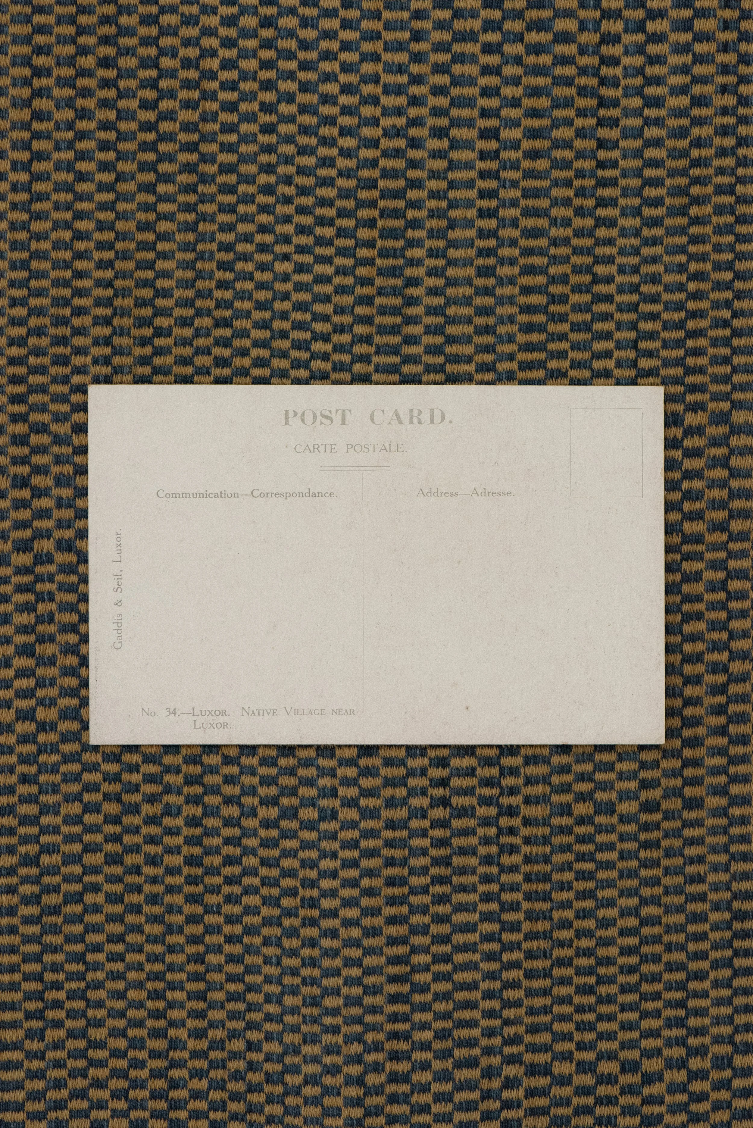 Back of vintage Egyptian postcard with writing space, labeled as a native village near Luxor, Egypt.