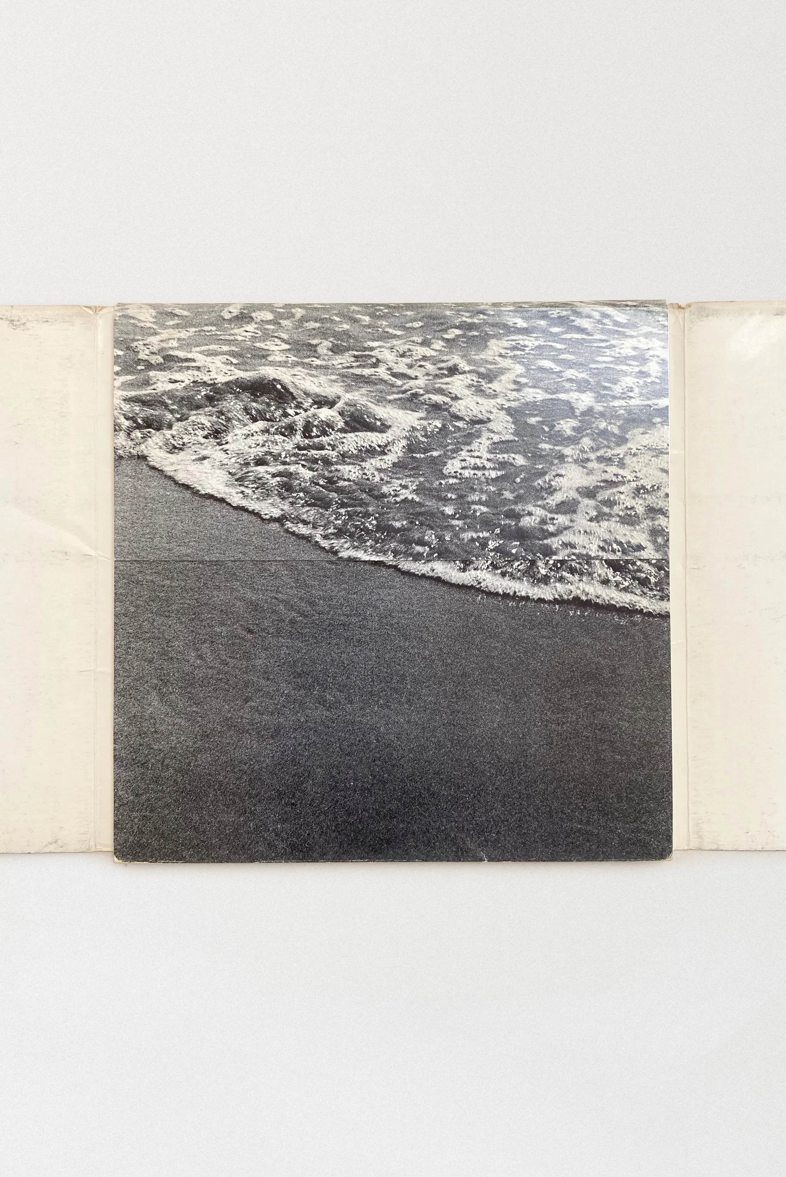 The full wraparound cover of West Coast: 1945–1969 reveals a striking photograph of California surf — a visual metaphor for the creative energy flowing through the postwar West Coast art scene.