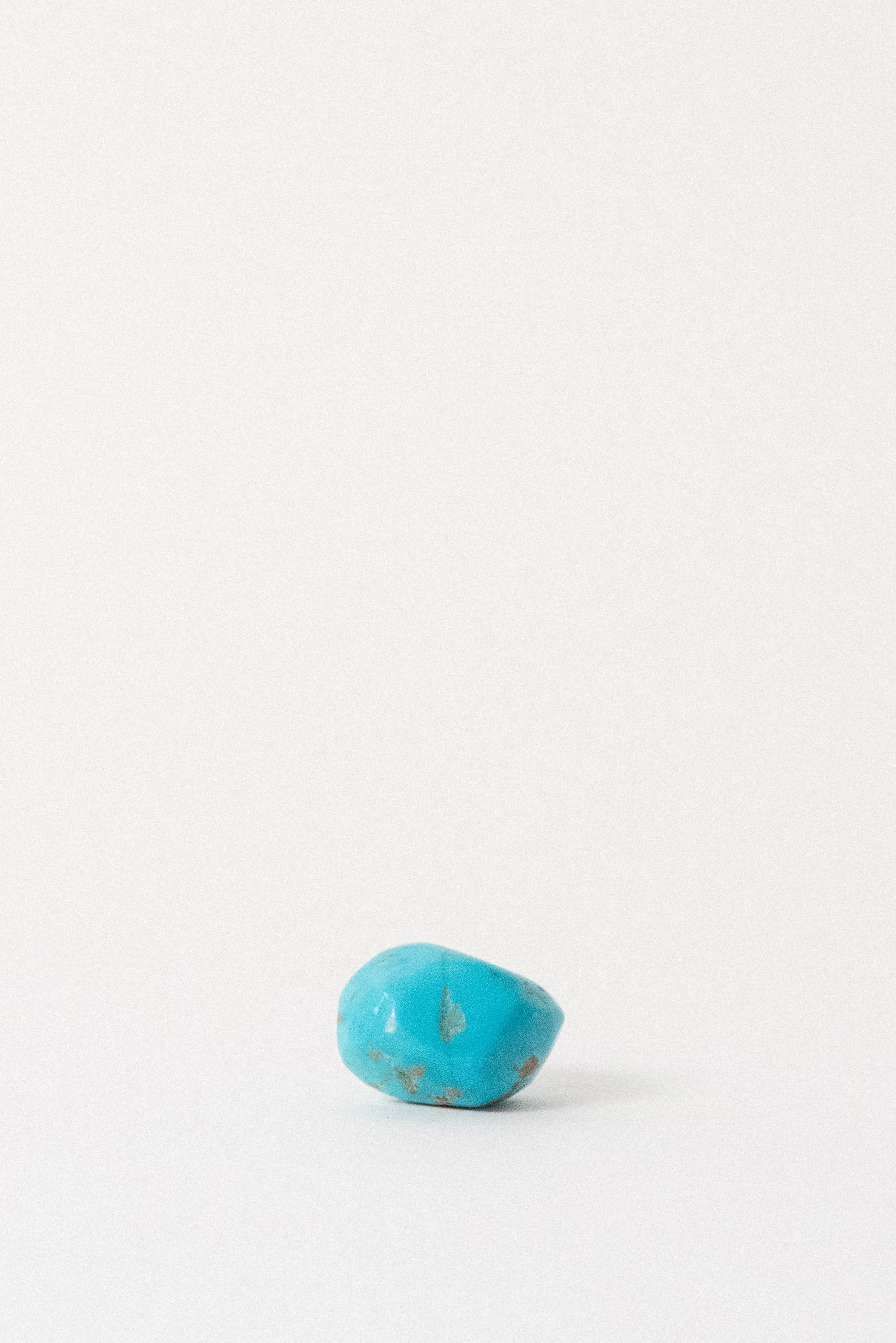 Polished turquoise nugget from Sinai Egypt with visible surface veins