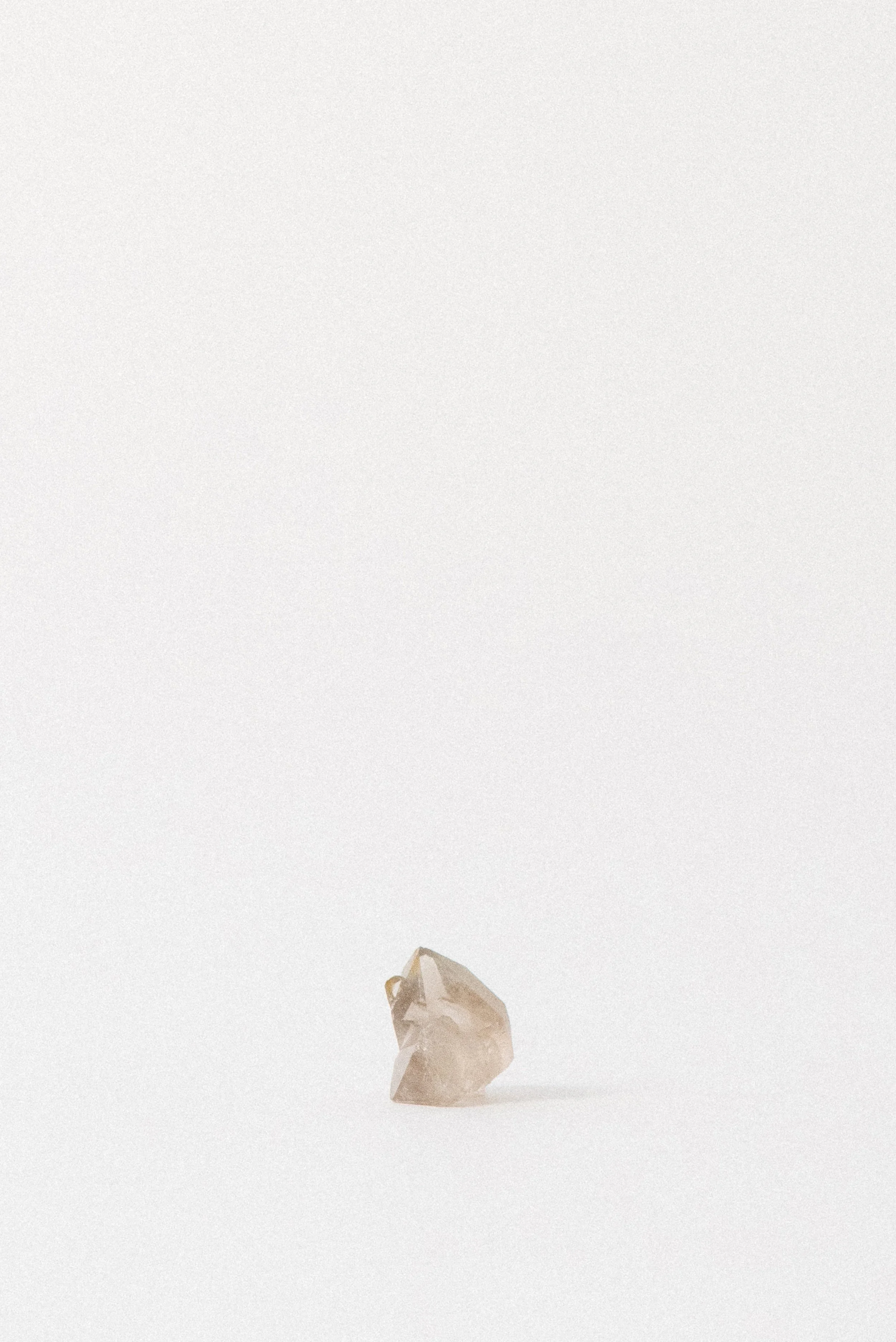 Side view of a small smoky quartz cluster from Erongo Mountain, Namibia. Displays well-formed crystal points with a soft smoky tint.