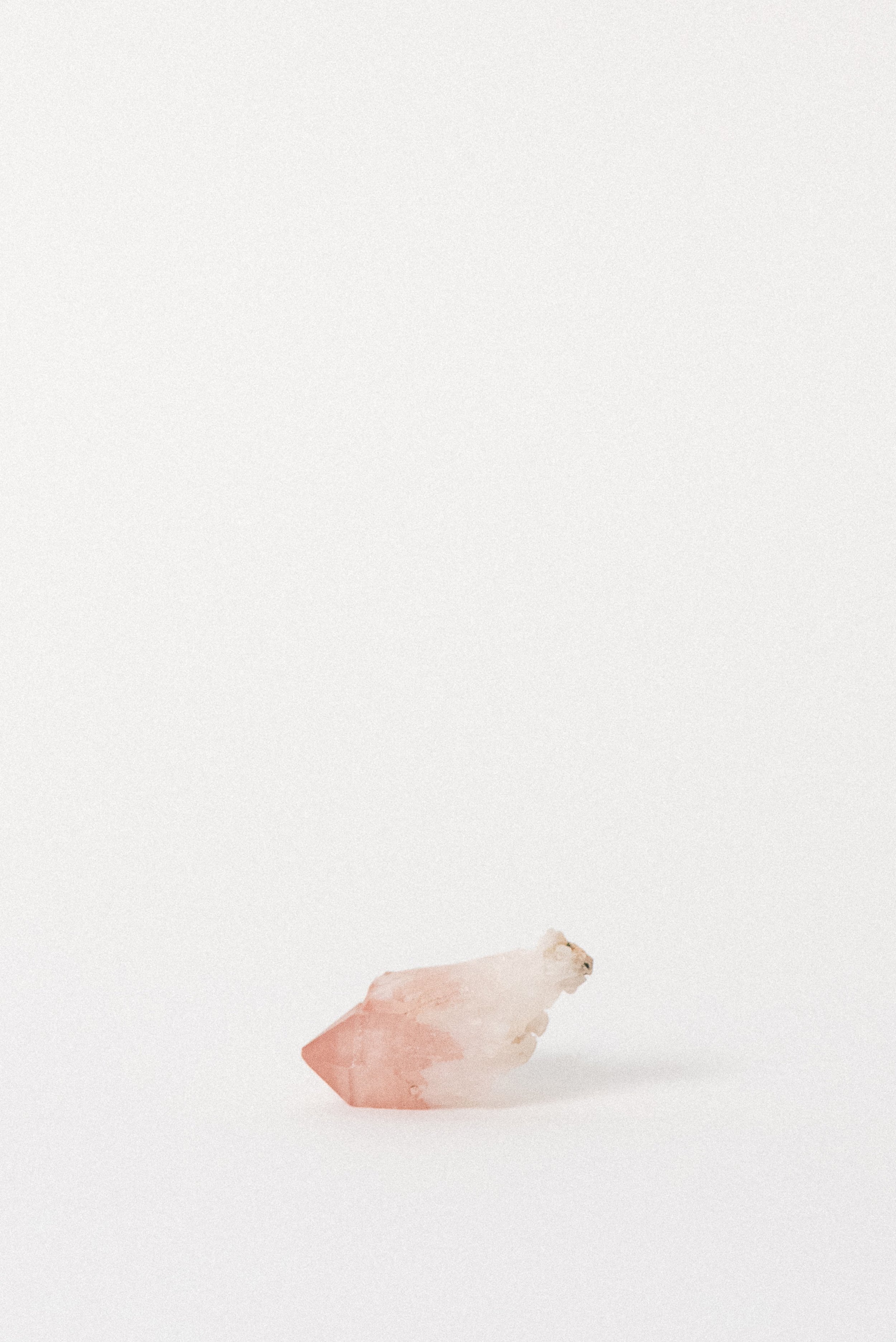 Side angle of Hematite Pink Quartz highlighting natural termination and clarity