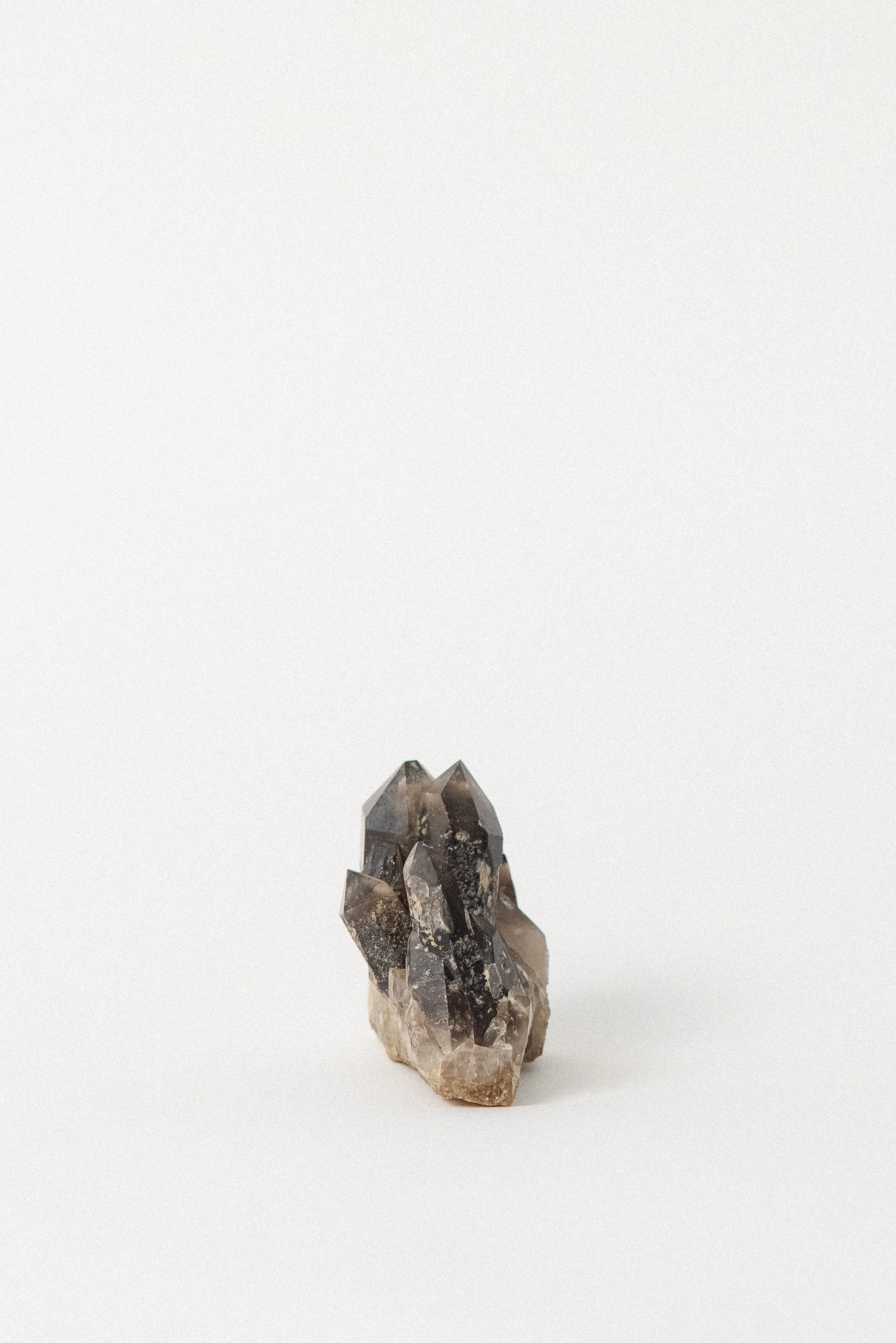 Smoky quartz cluster showing defined terminations and layered growth, from Hallelujah Junction.