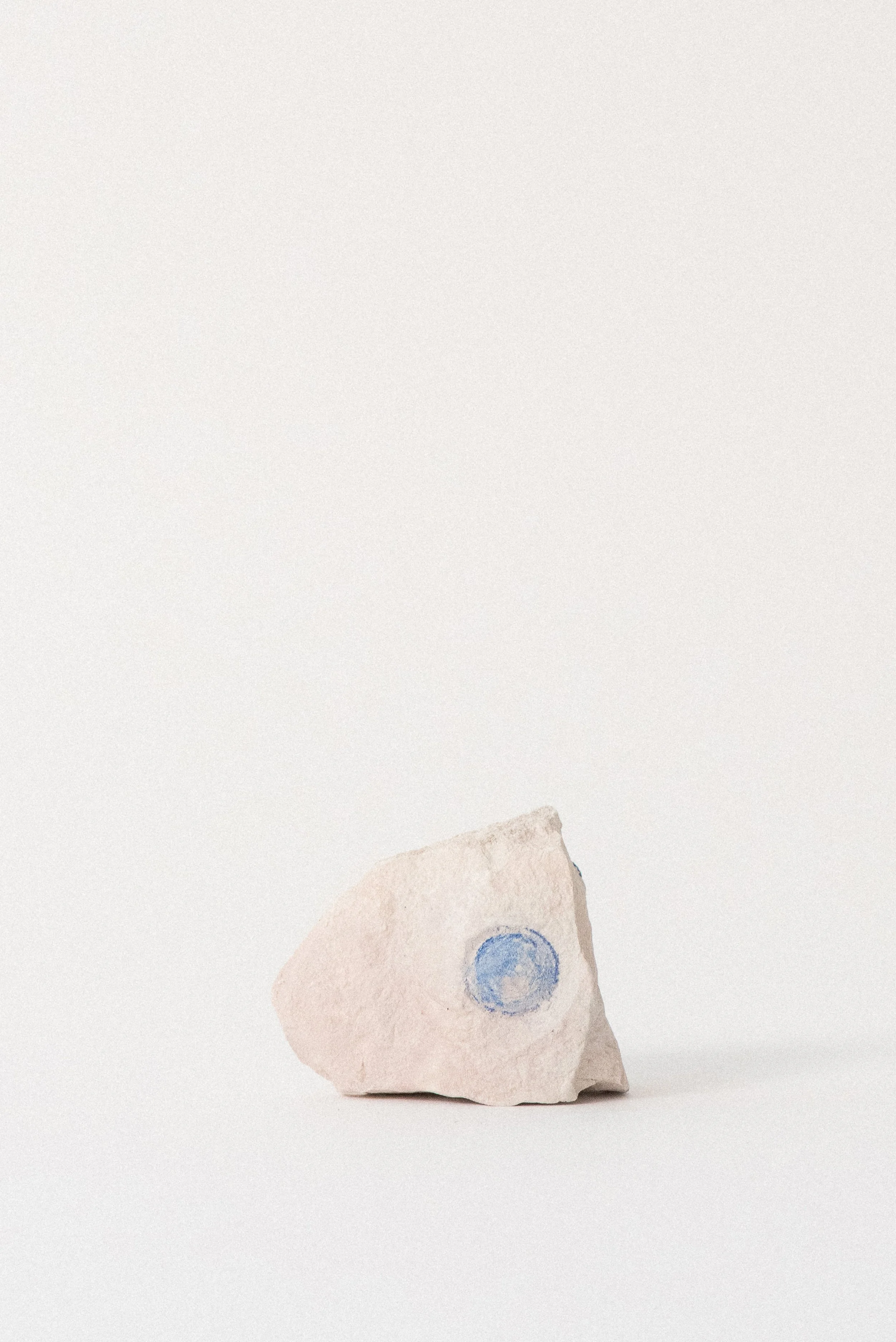Light blue azurite sun forming a delicate circular imprint on pale clay matrix, from Malbunka Copper Mine in Australia's Northern Territory.