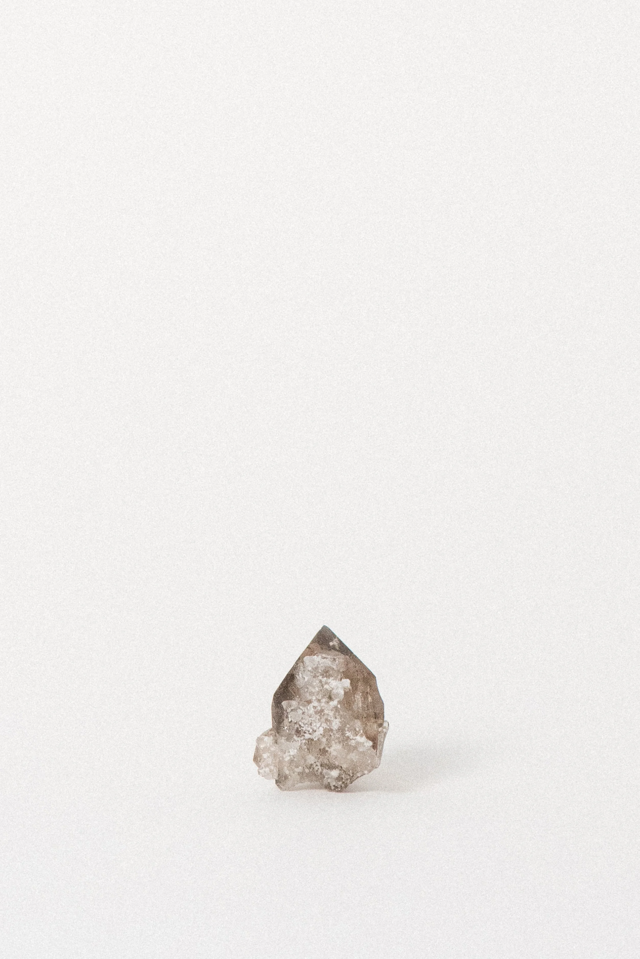 Clear smoky quartz crystal from Chamonix, France with visible internal structure.