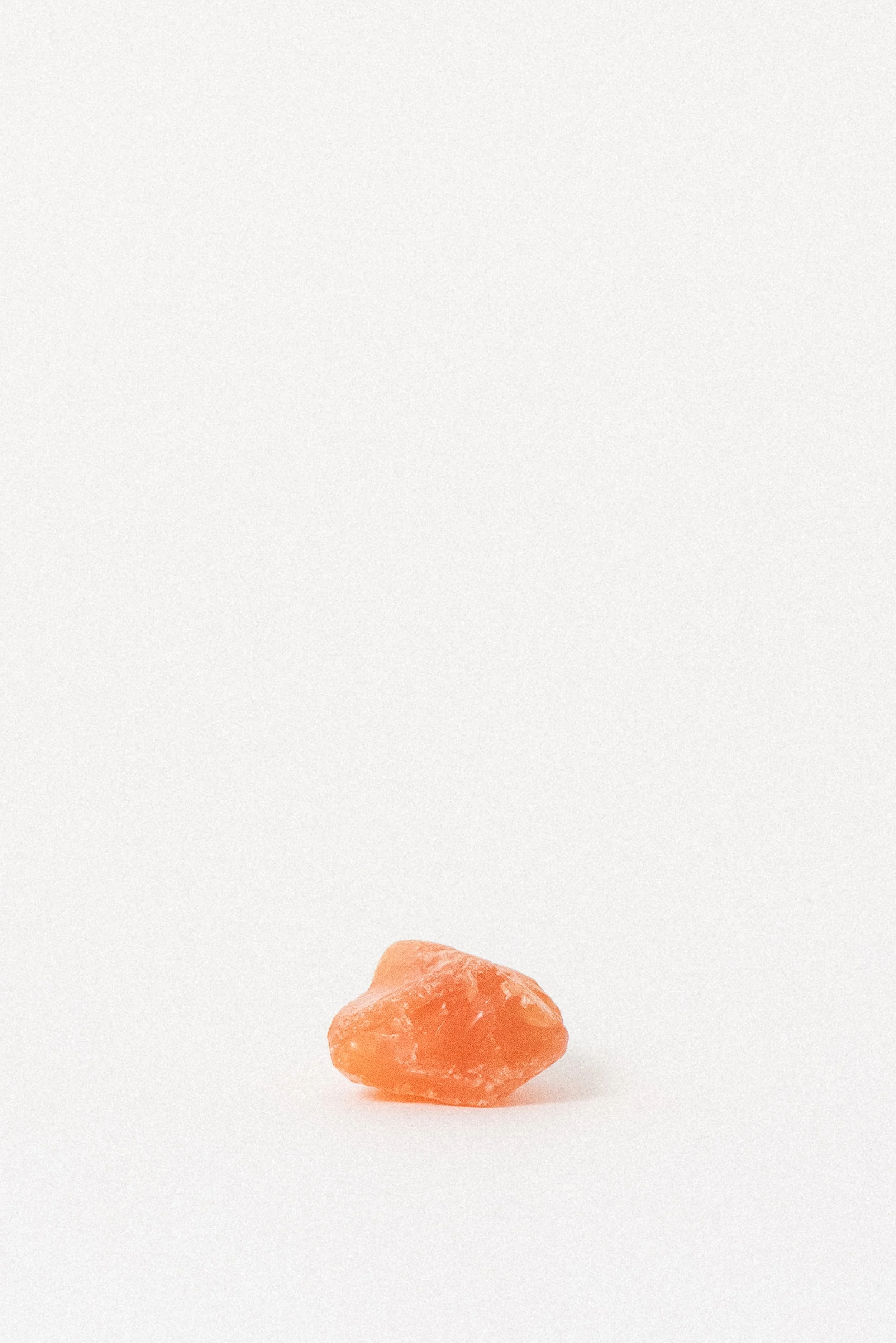 Natural African carnelian crystal with angular shape and bright orange hue