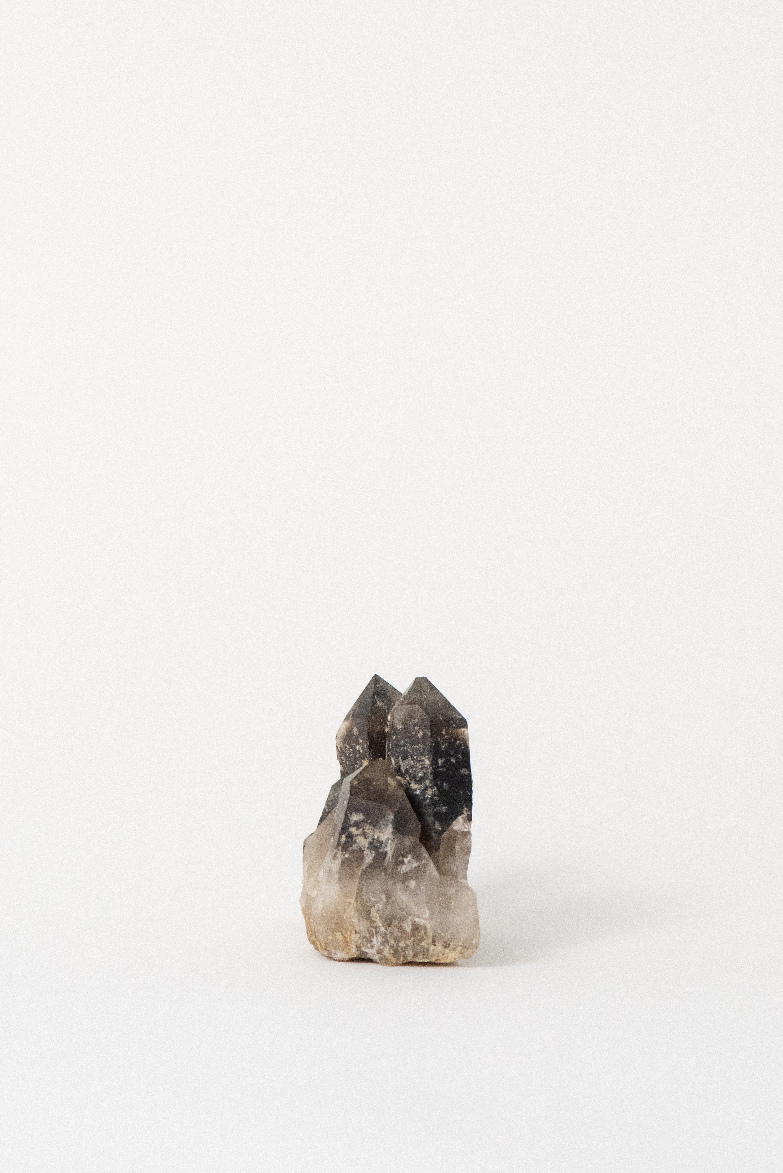 Profile view of a natural smoky quartz formation from Hallelujah Junction, ethically mined.