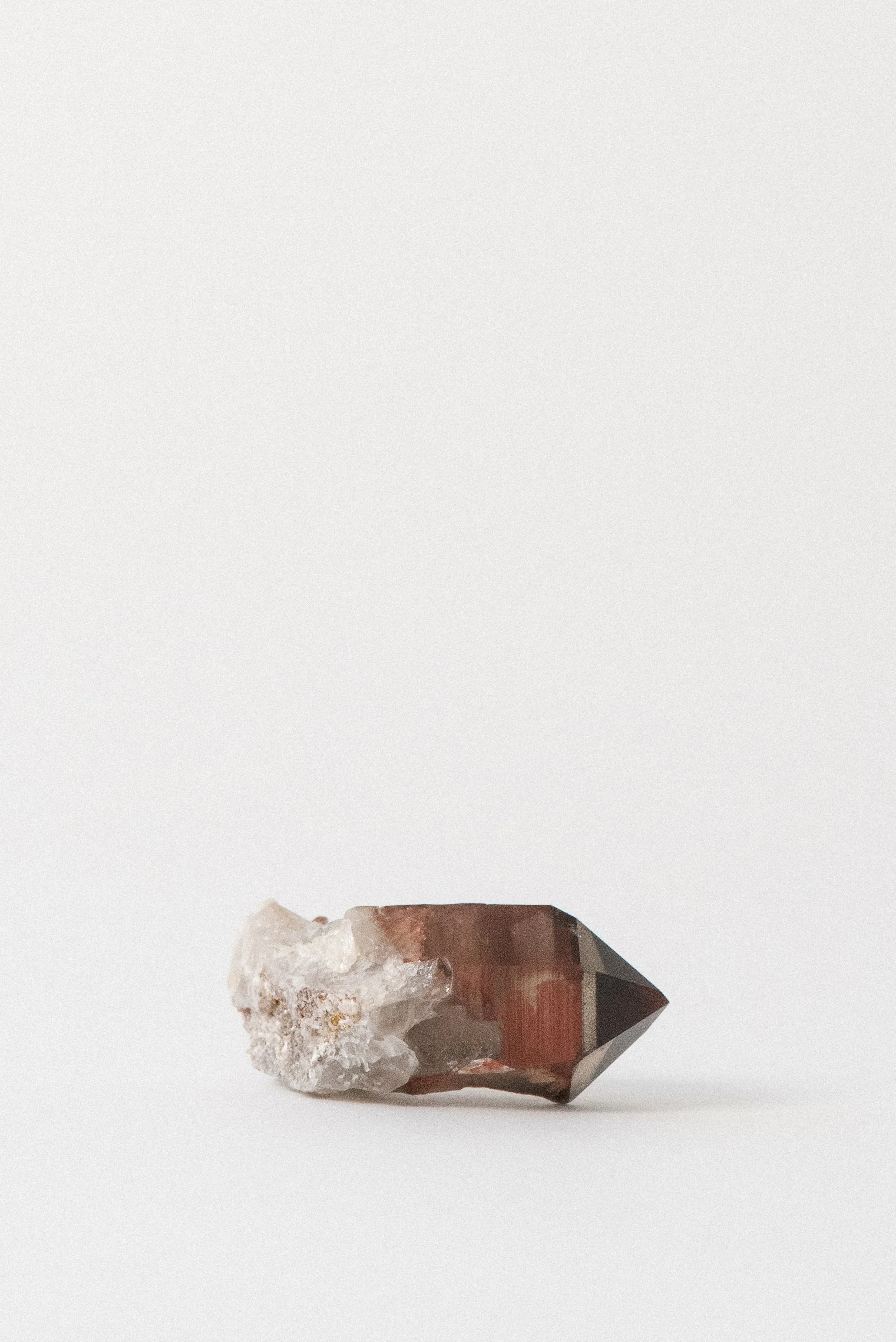 Hematoid quartz specimen with deep red coloring from oxidized iron minerals.