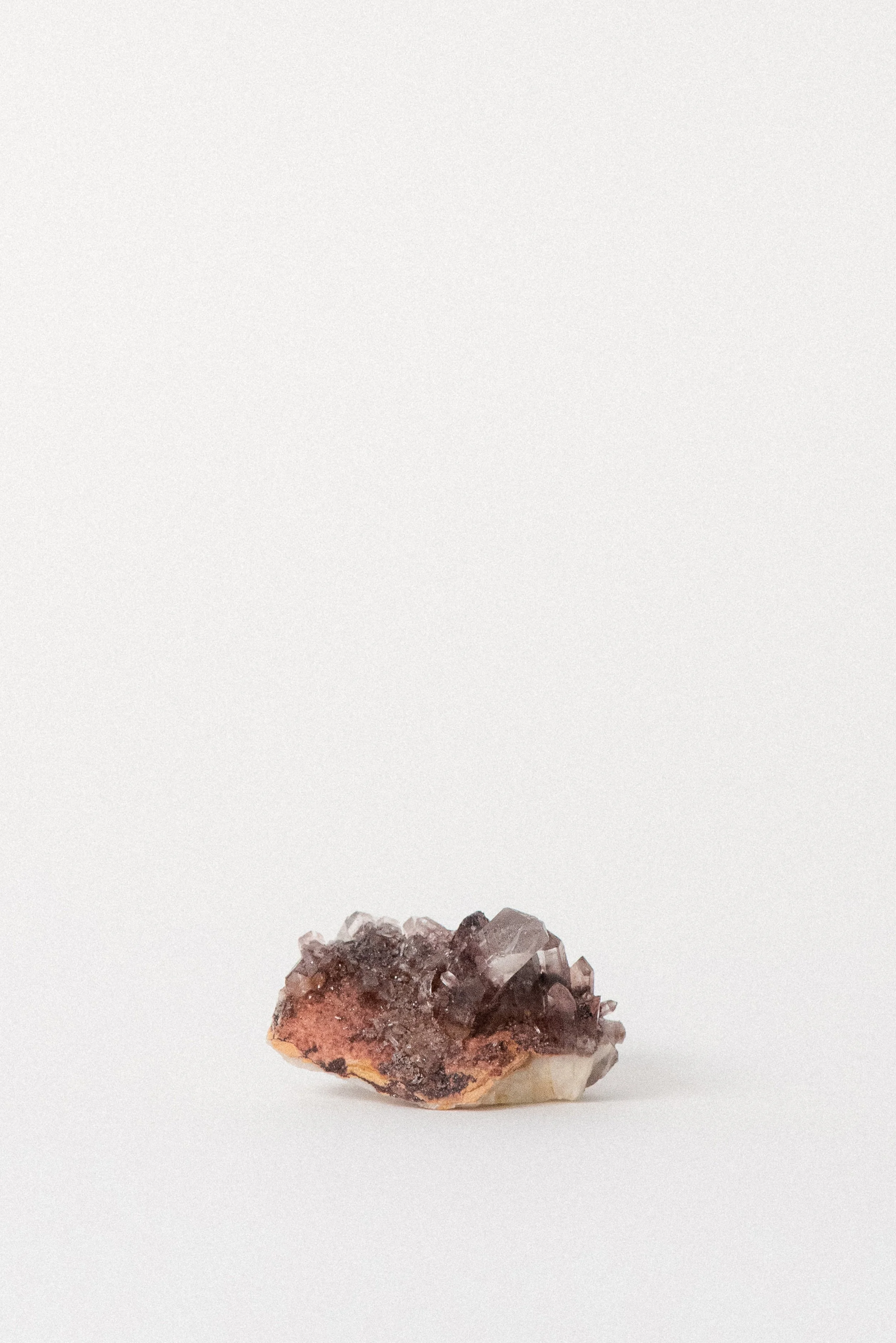 Underside matrix of red-tinted Phantom Quartz cluster