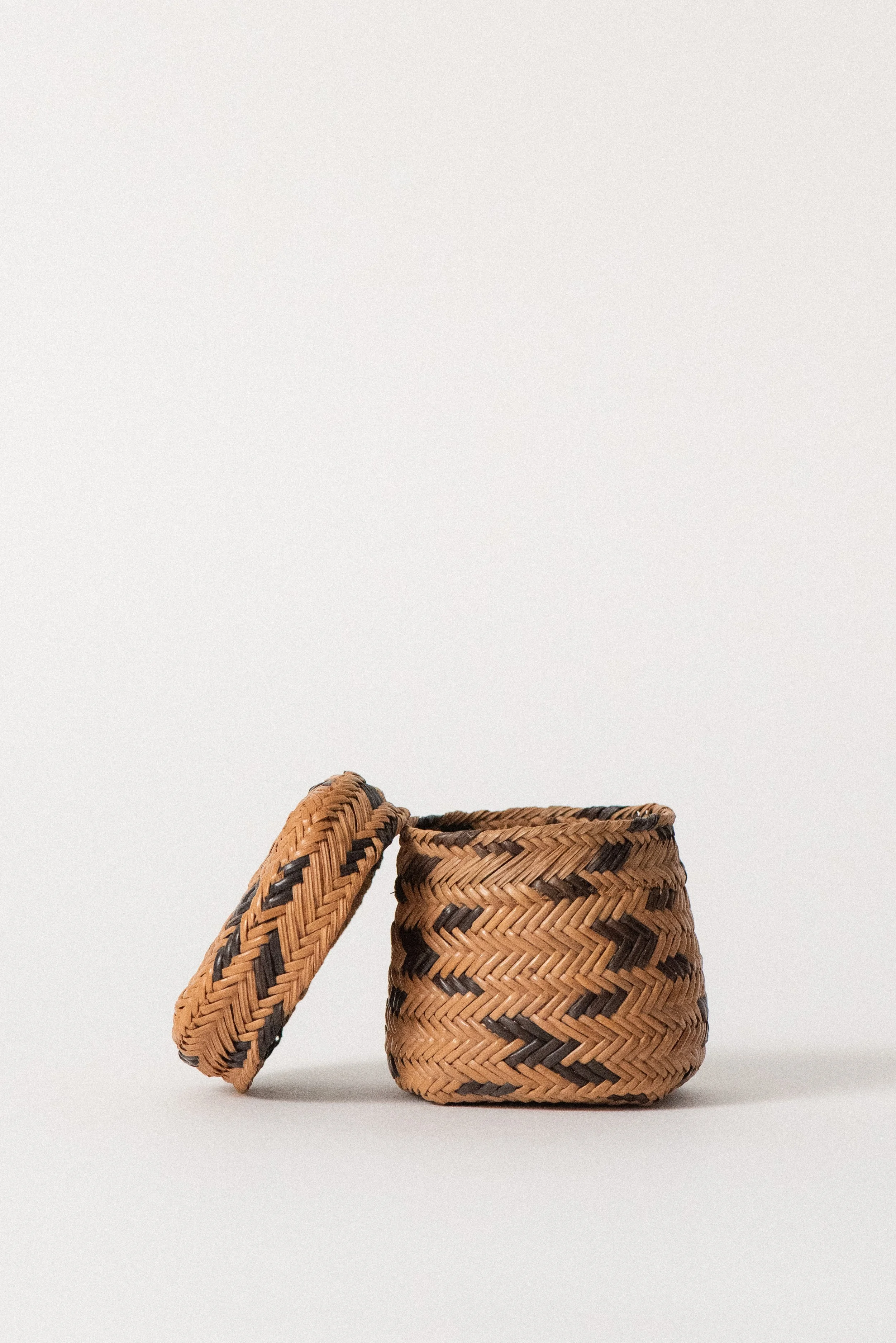 Open view of 1960s miniature Tarahumara basket made of handwoven pine needles, showcasing detailed interior craftsmanship.
