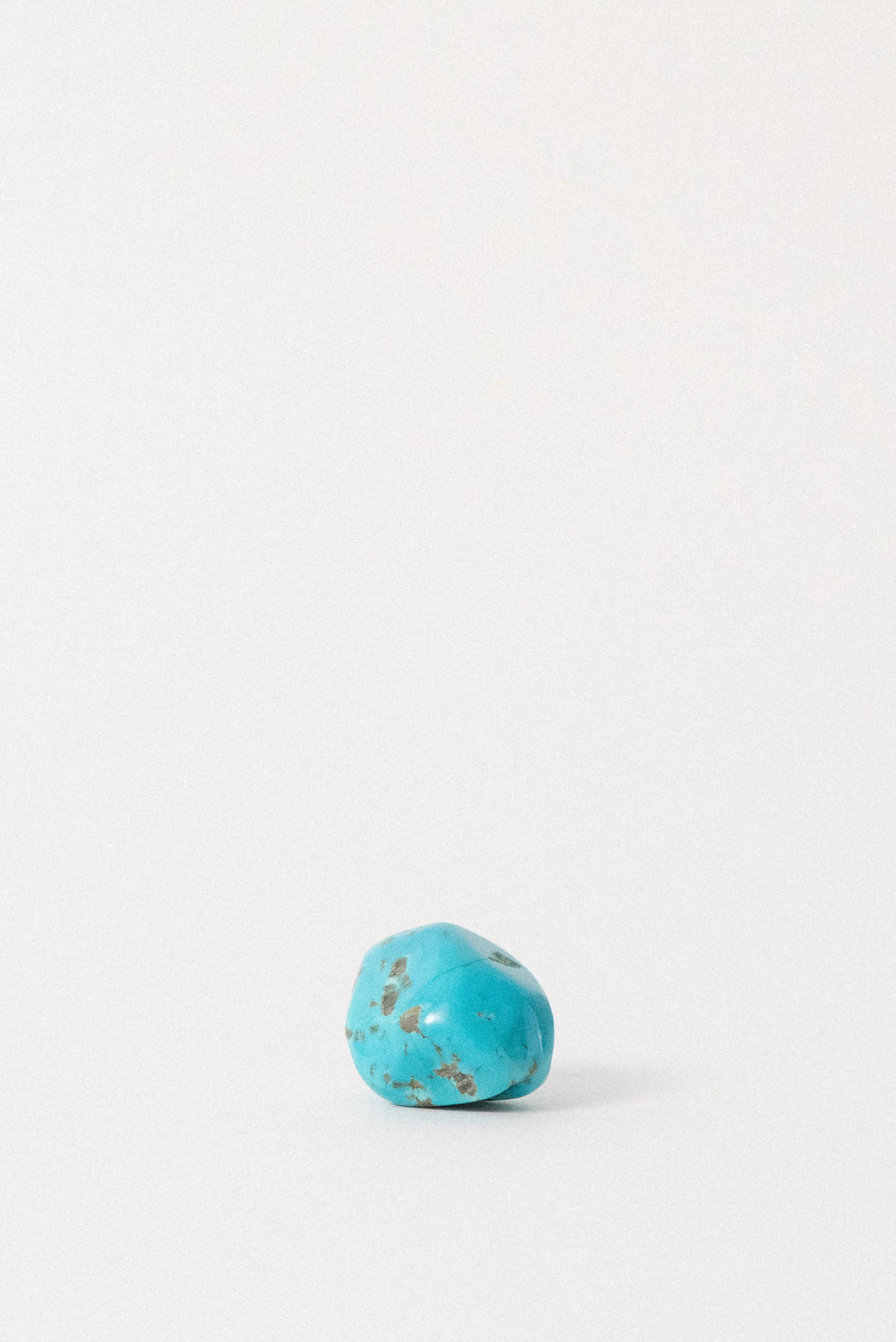 Turquoise stone specimen from Sinai Egypt photographed on white background