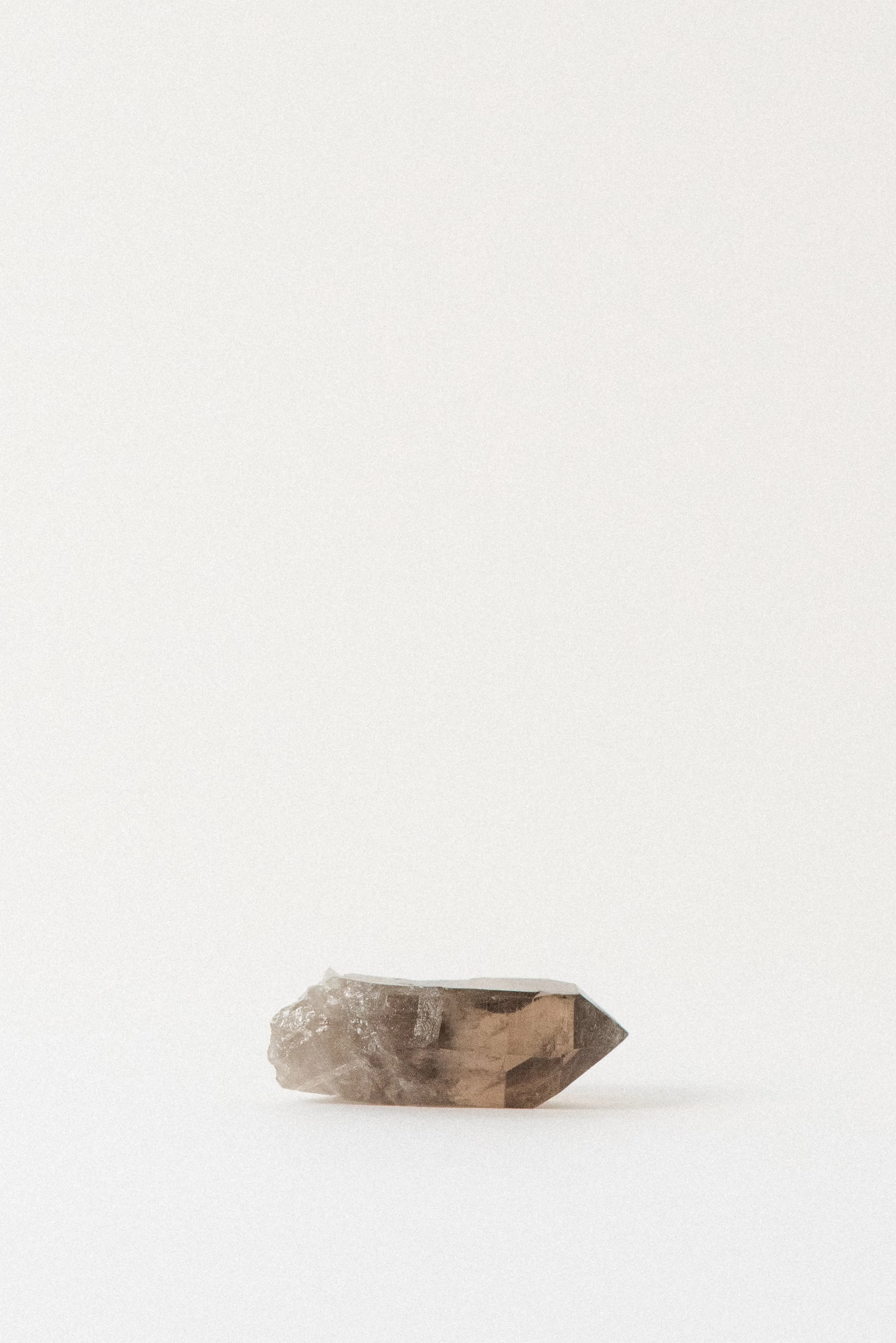 Smoky quartz crystal from L’Aiguille de Talèfre, Mont Blanc, Chamonix – alpine specimen showing rear face with natural clarity and raw matrix edge