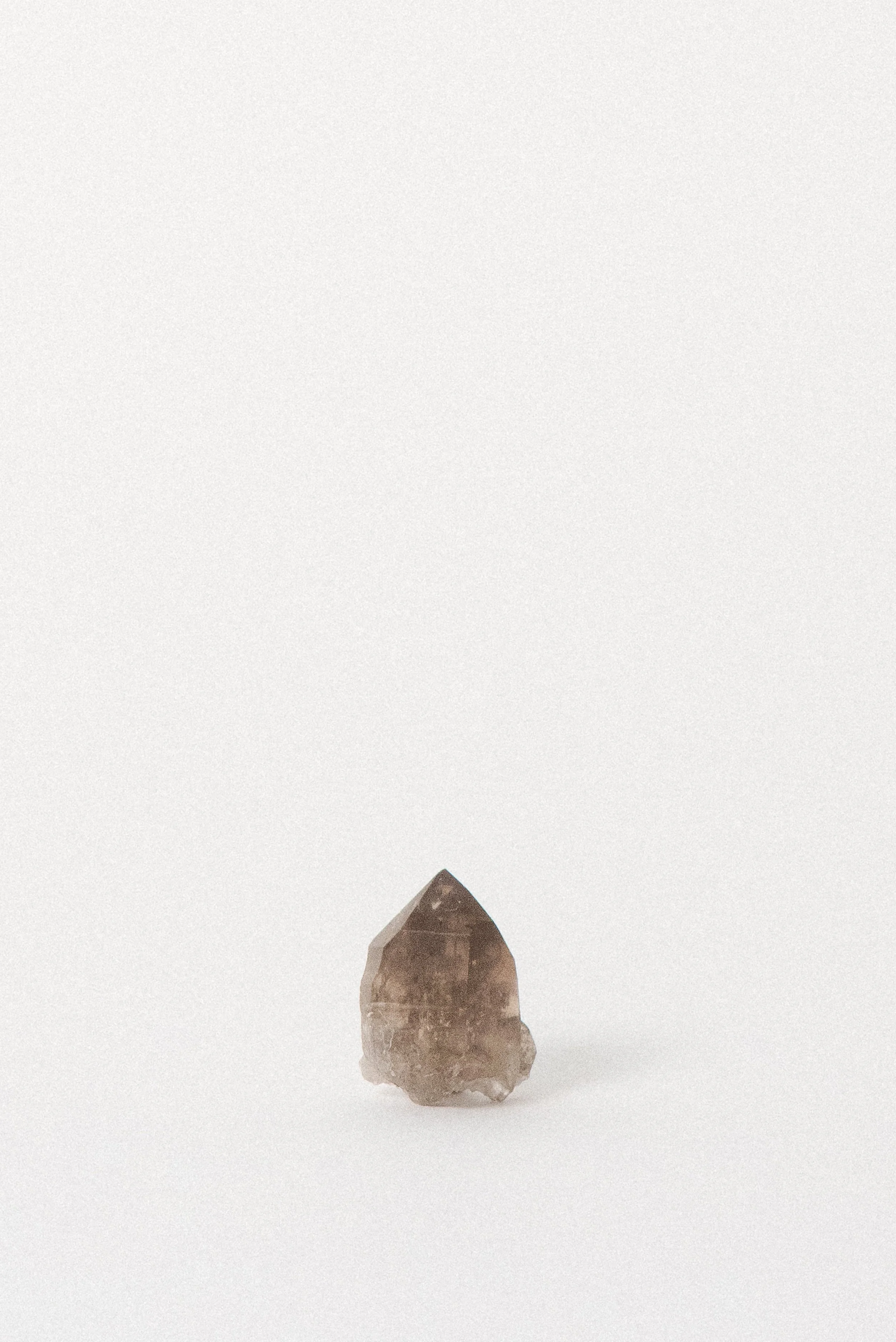 Smoky quartz mineral specimen from Mont Blanc, showing clarity and light zoning.