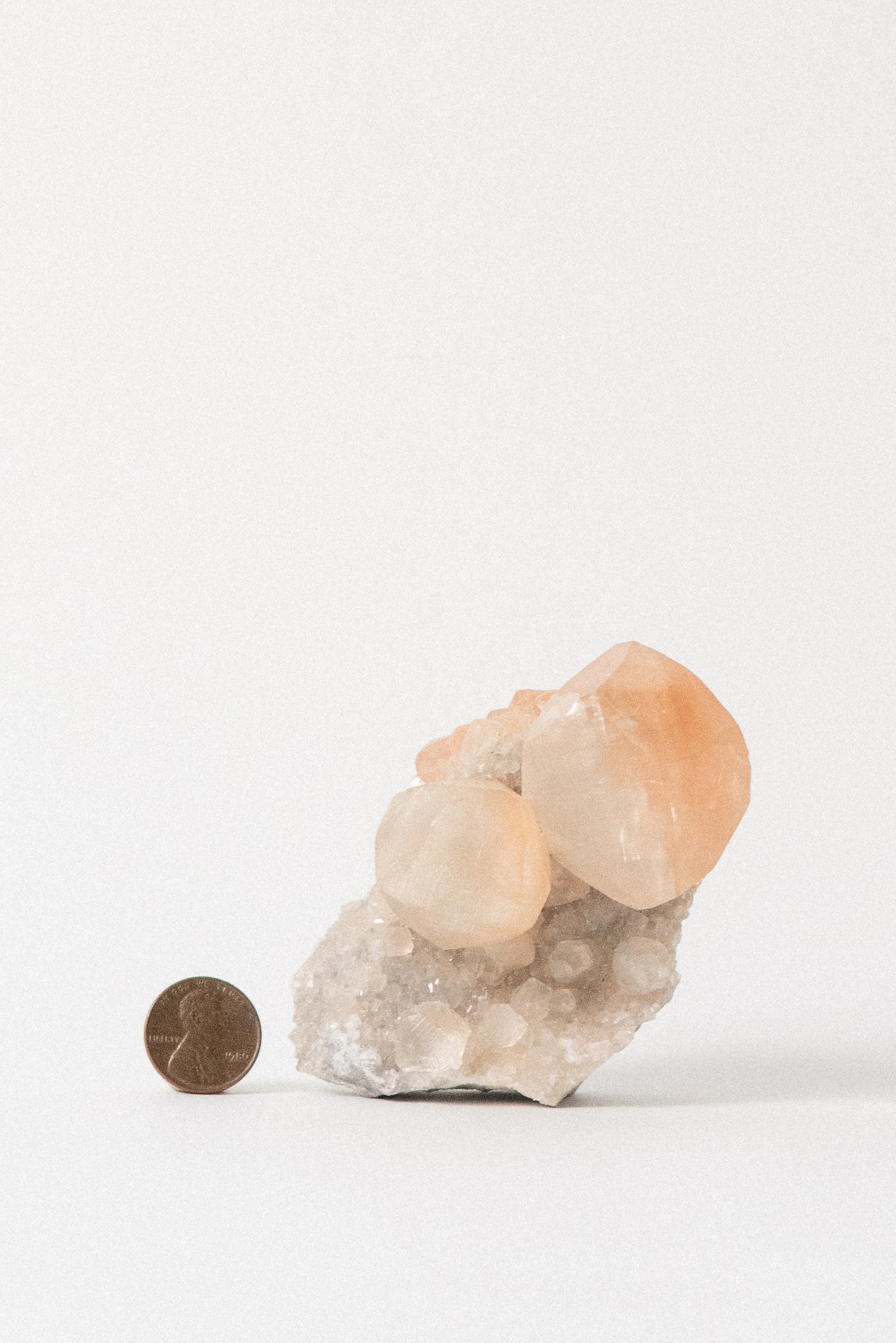 Crystal-Voyager-Peach-Calcite-Diamonds-on-Matrix-Hubei-China-1.jpg