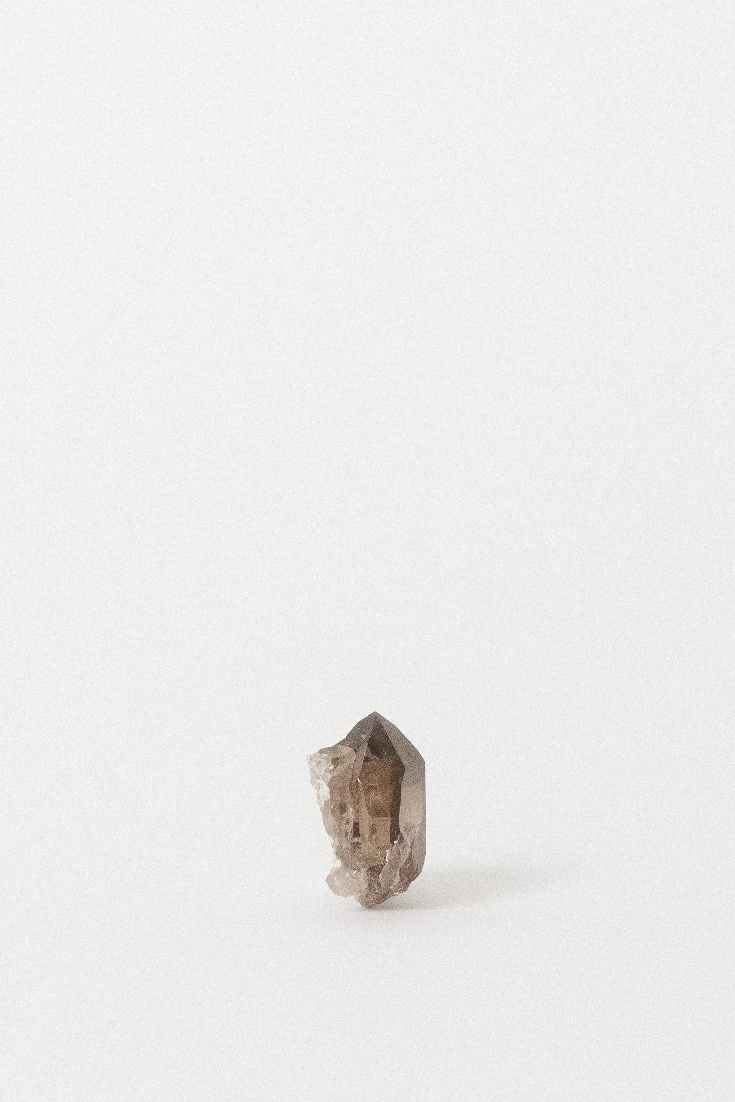 Smoky quartz crystal with light inclusions from Mont Blanc Massif, Chamonix, Europe.