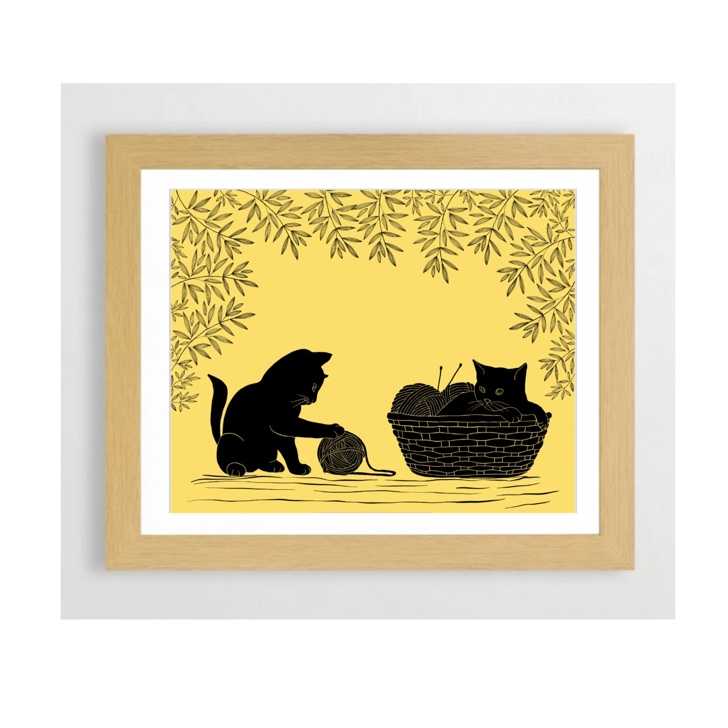 Cats playing with yarn and taking a nap in the yarn basket