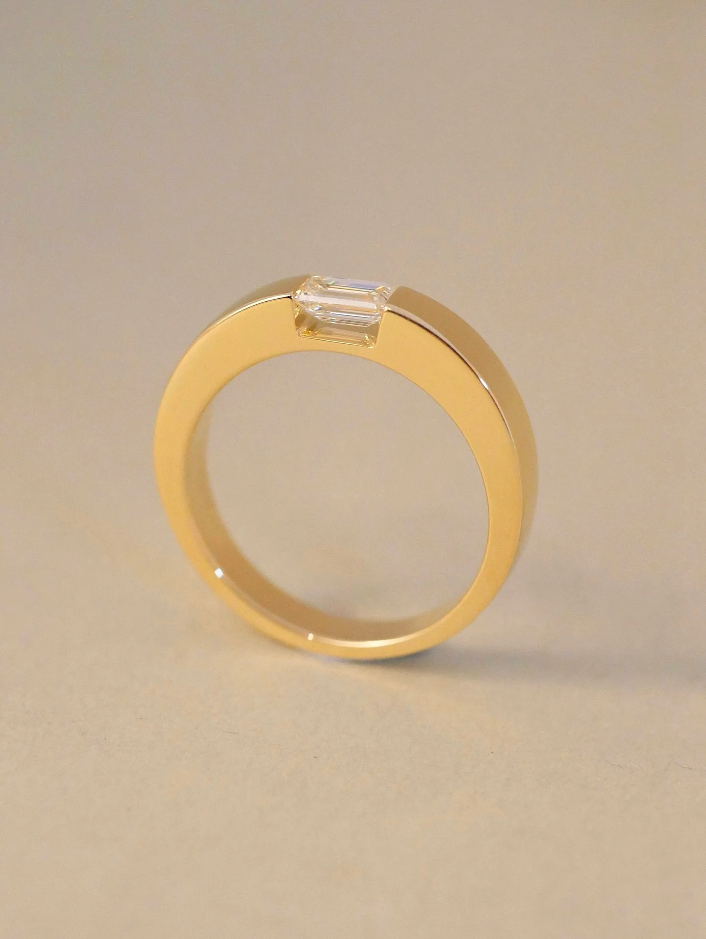 Tension Set Band Ring &mdash;&mdash; with a Natural Diamond Emerald Cut &amp; 18ct yellow gold ⁣
⁣
Congratulations to Lance &amp; Maddie on their wonderful engagement! It never gets old being able to see a piece on the wearers hand in person - it rea