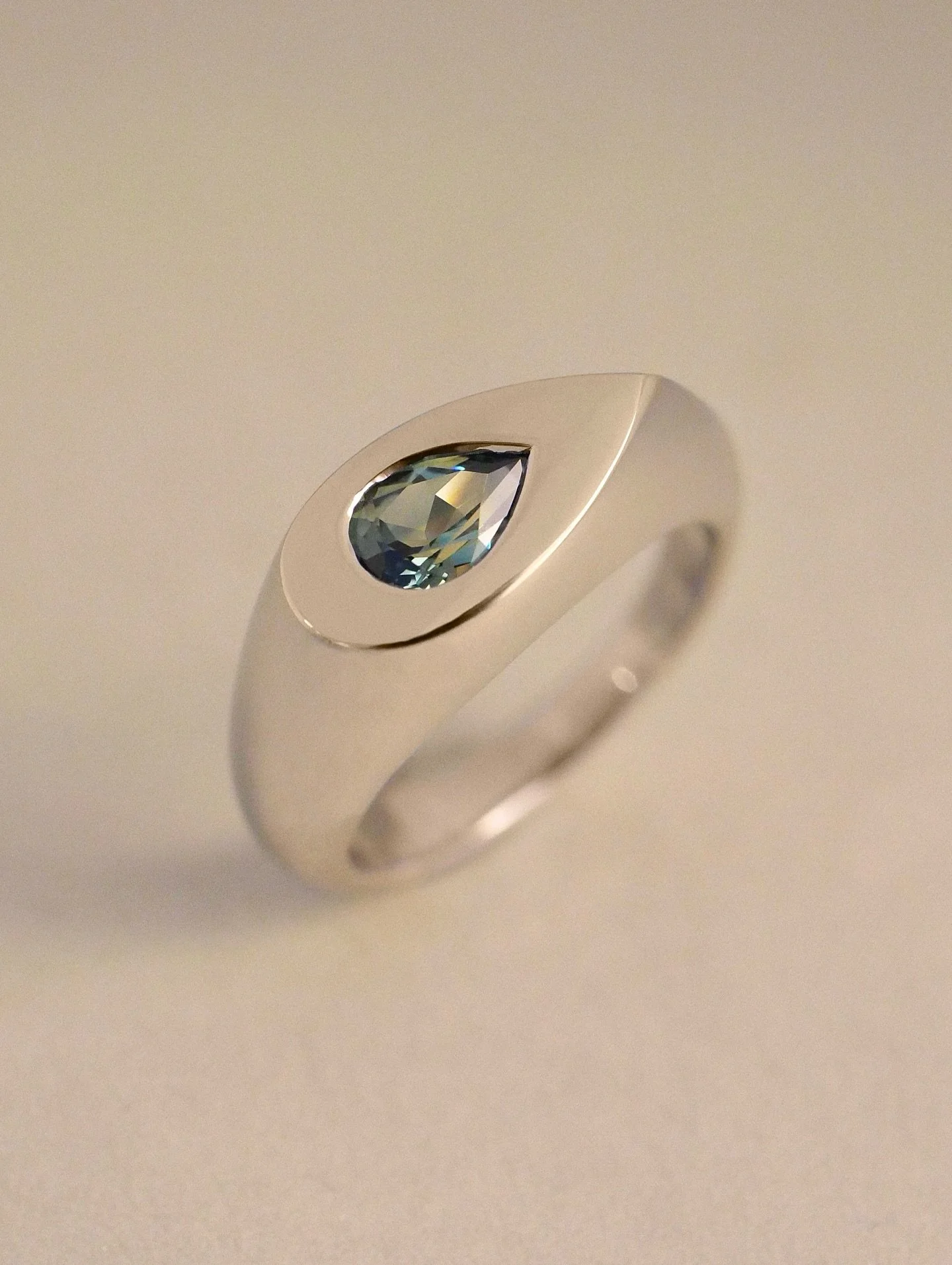 PLATINUM Pear Signum Ring &mdash;&mdash; with a Natural Australian Parti Sapphire ⁣
⁣
An engagement ring for Skye ✨ My first Pear Signum in platinum, and it did not disappoint! The piece had a nice solid weight to it and the way the cool metal brings