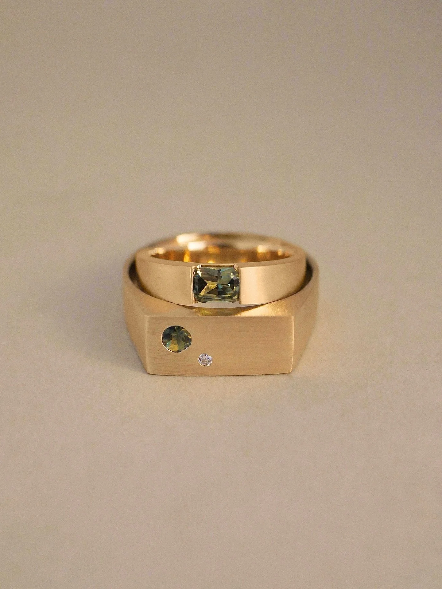 For Rosie &amp; Baz 💚 A special commission featuring Australian green parti sapphires to celebrate the life they&rsquo;ve built here in Australia. Both rings are finished with a brushed matte texture that beautifully highlights the stones colours gr