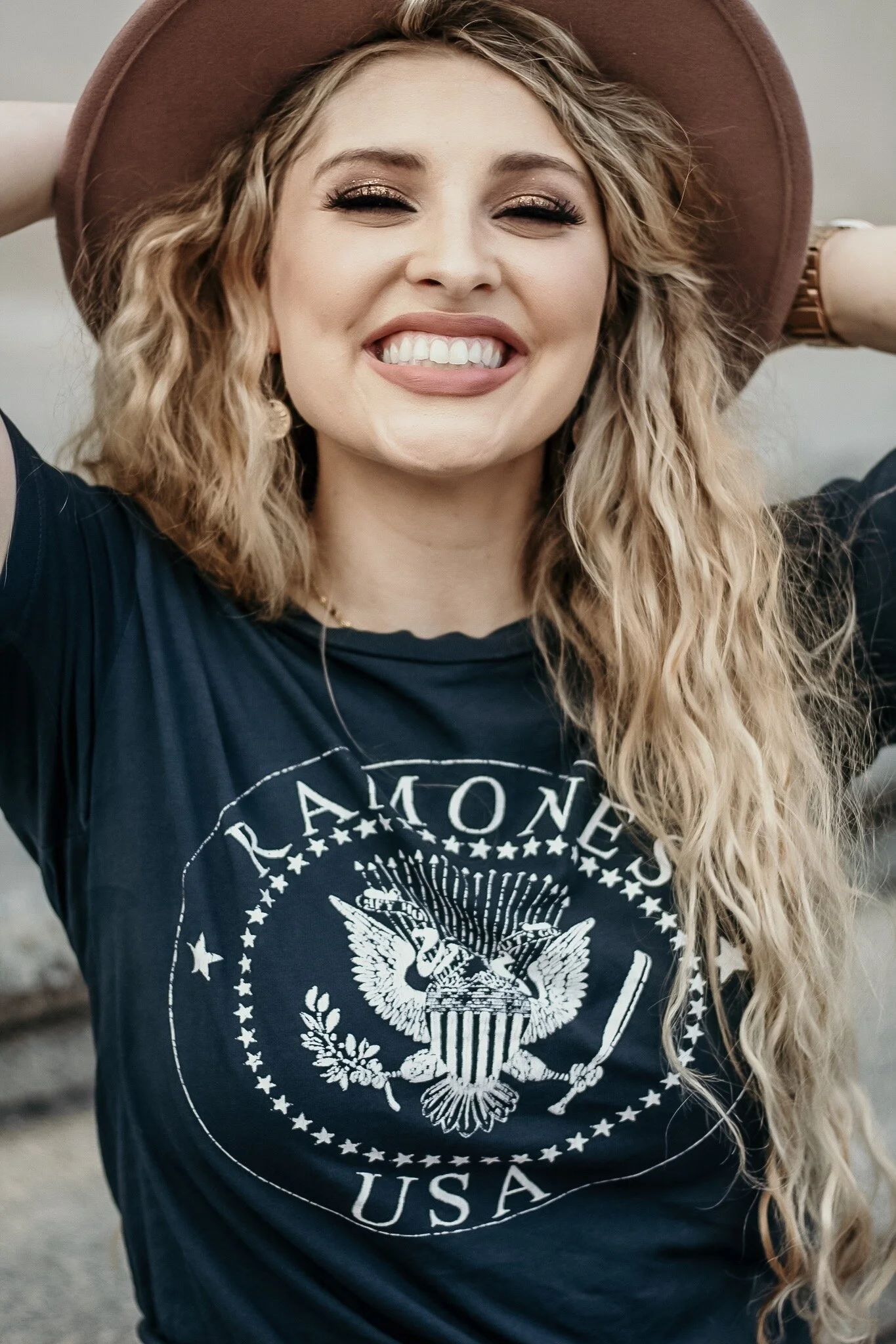 Band Tees and skirts are high key trending right now. Most boutiques or online stores carry these super soft tees perfect for tying up or tucking into your clothes.