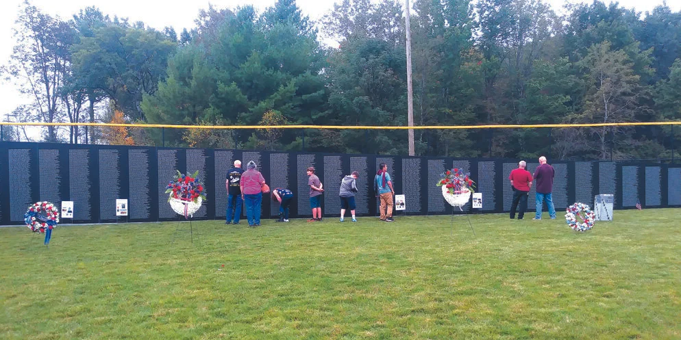 SOBERING Students from Livingston Manor Central School view the thousands of names that cover the wall of the traveling version of the Washington, DC, Vietnam Veterans Memorial. The memorial was erected in Rock Hill and later traveled to Monticello. Luca Larizzati photo