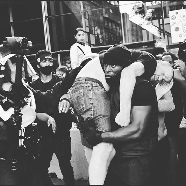 Woke up to see this incredible picture taken yesterday in London of a #blm supporter carrying a counter protestor to safety. When peaceful @blklivesmatter protests happened all over the country (see second photo from Brighton) the far right / Britain