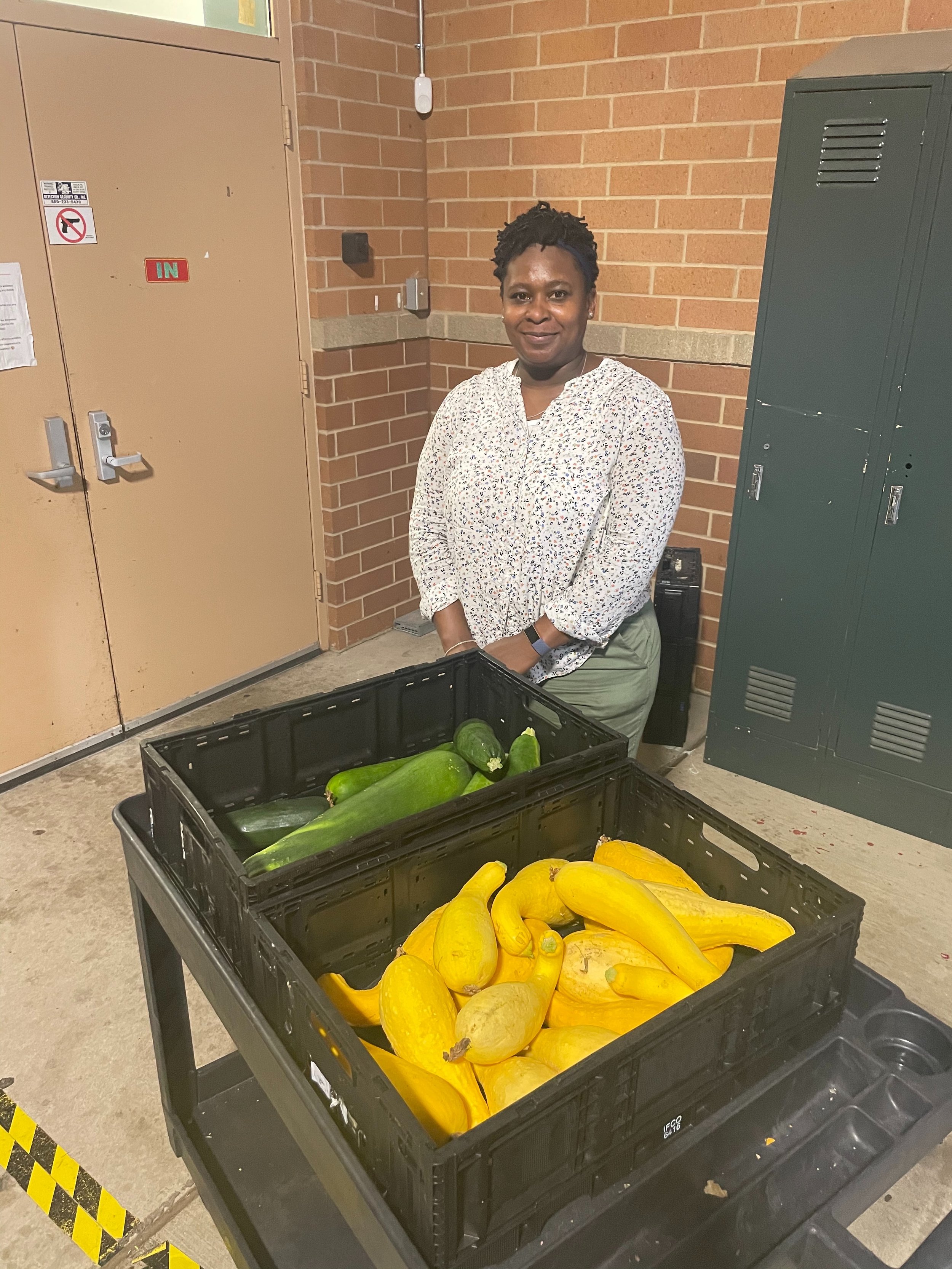 Northeast Community Fund ED Angel Lawrence receiving produce for their pantry.jpg