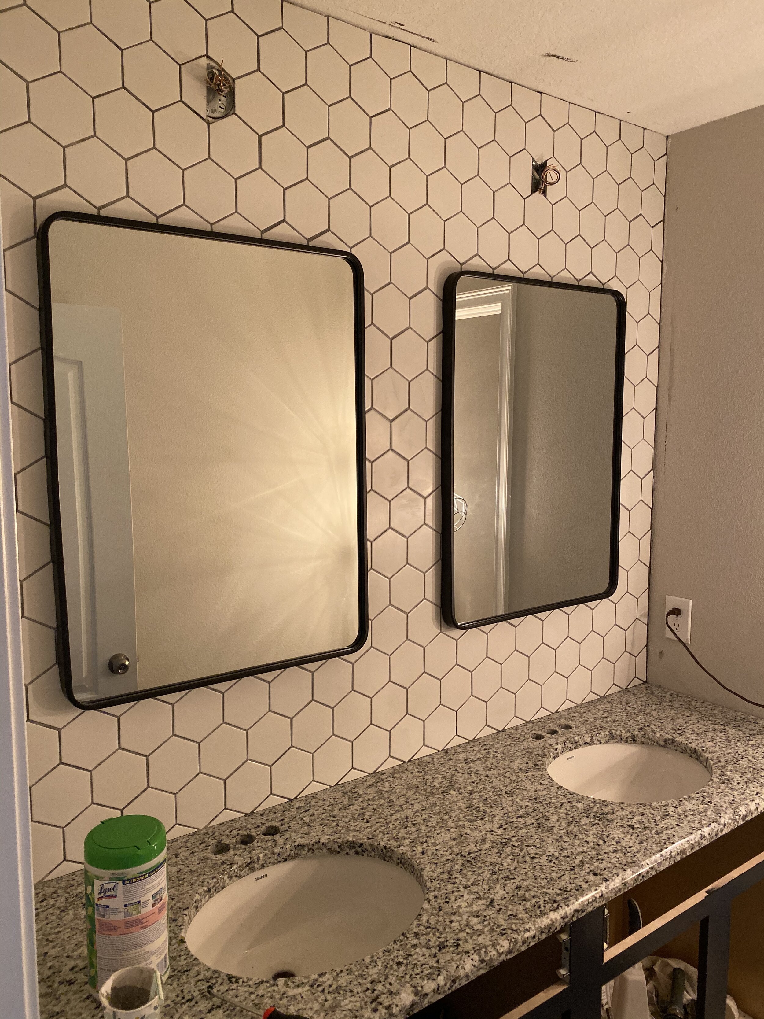 Grout is dry and mirrors are up!