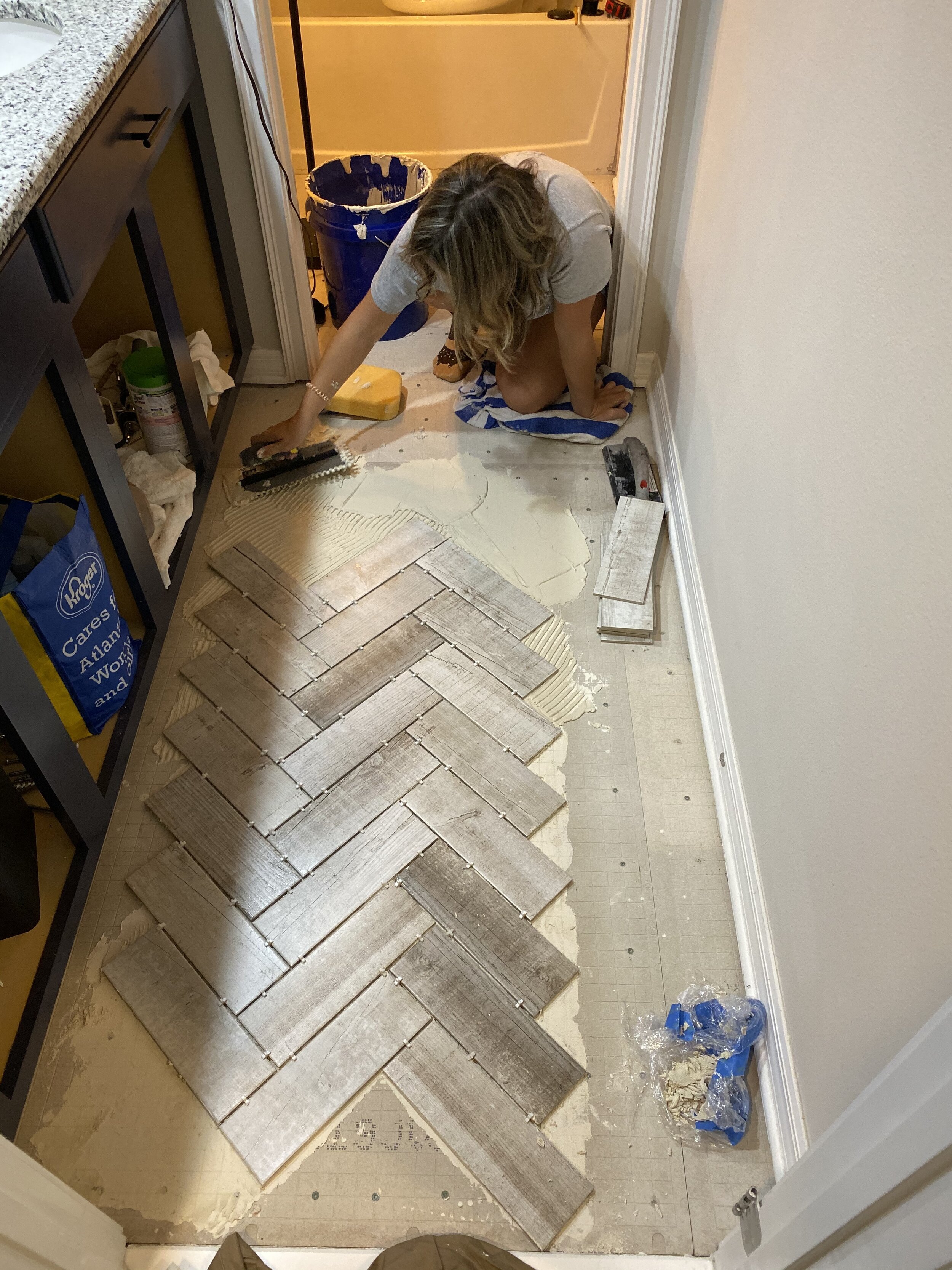 Ryan started out laying the tile, but I took over and did the entire floor!