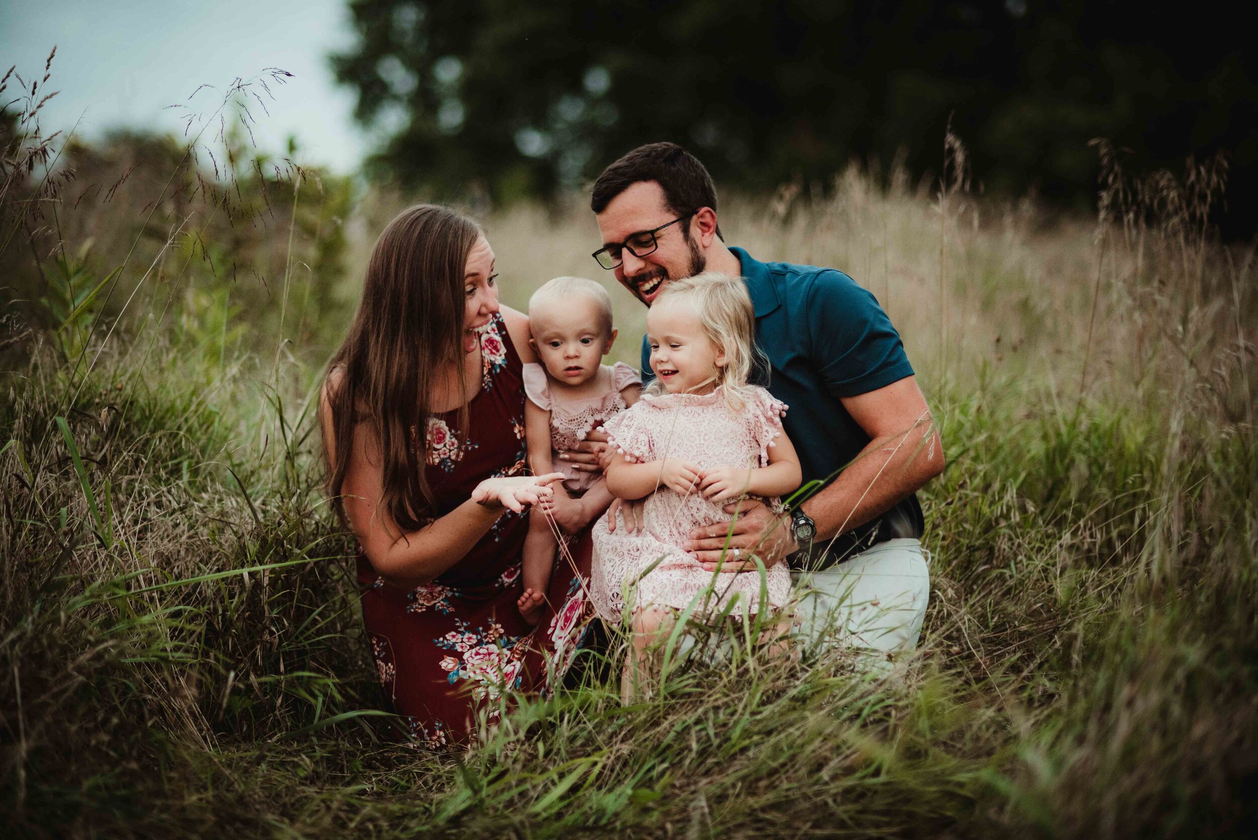 A lifestyle family session in West Lafayette, Indiana with two young toddler girls. Wearing burgundies, blues, and pinks.