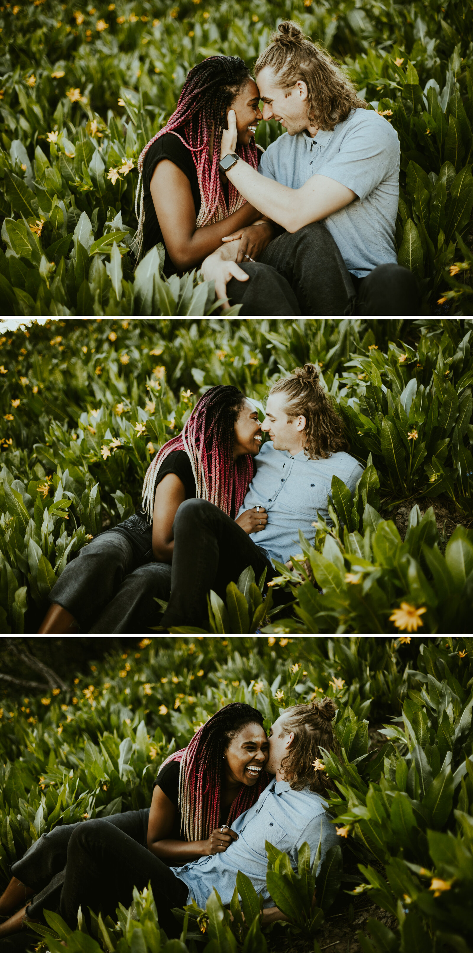 Couple snuggling in a field of yellow flowers woman has pink hair.jpg