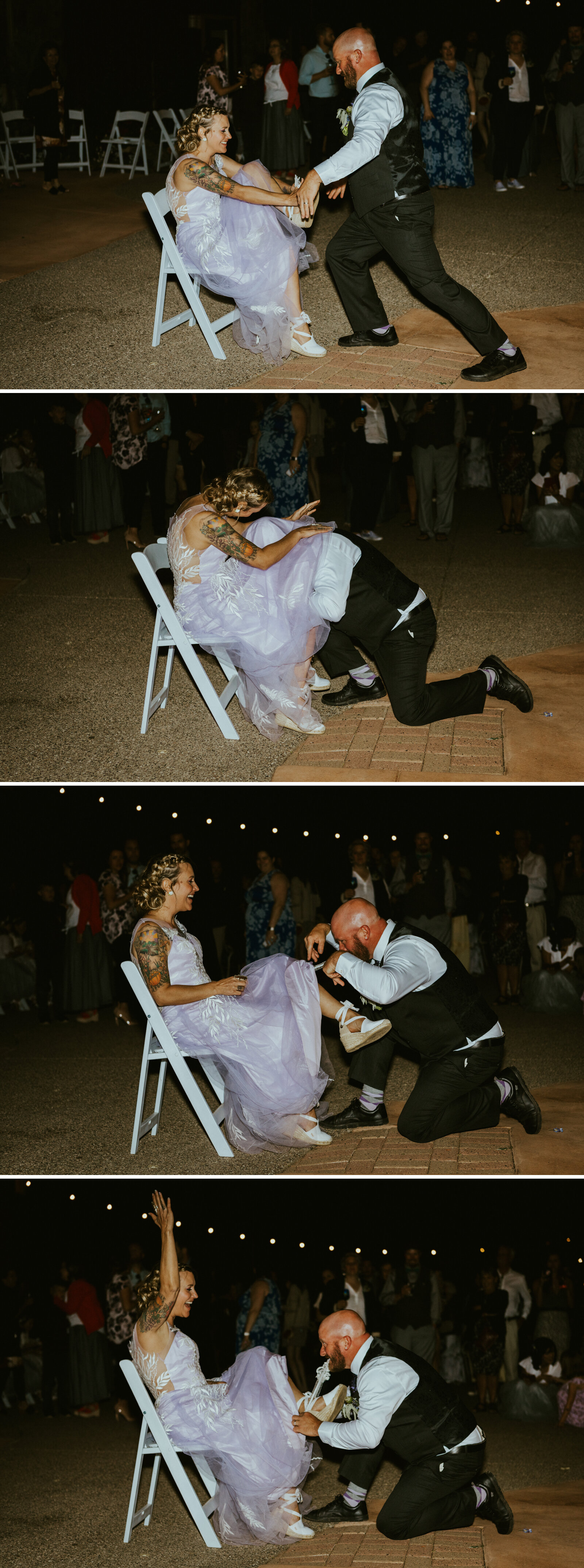 a groom taking his new wife's garter off during their wedding reception.jpg