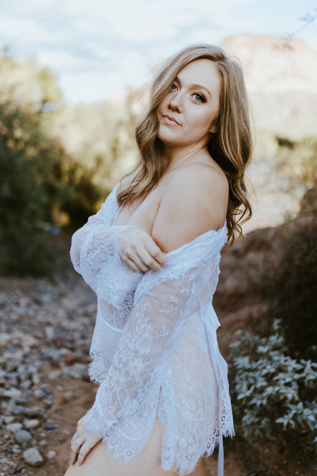  Woman in lingerie in nature boudoir photoshoot  