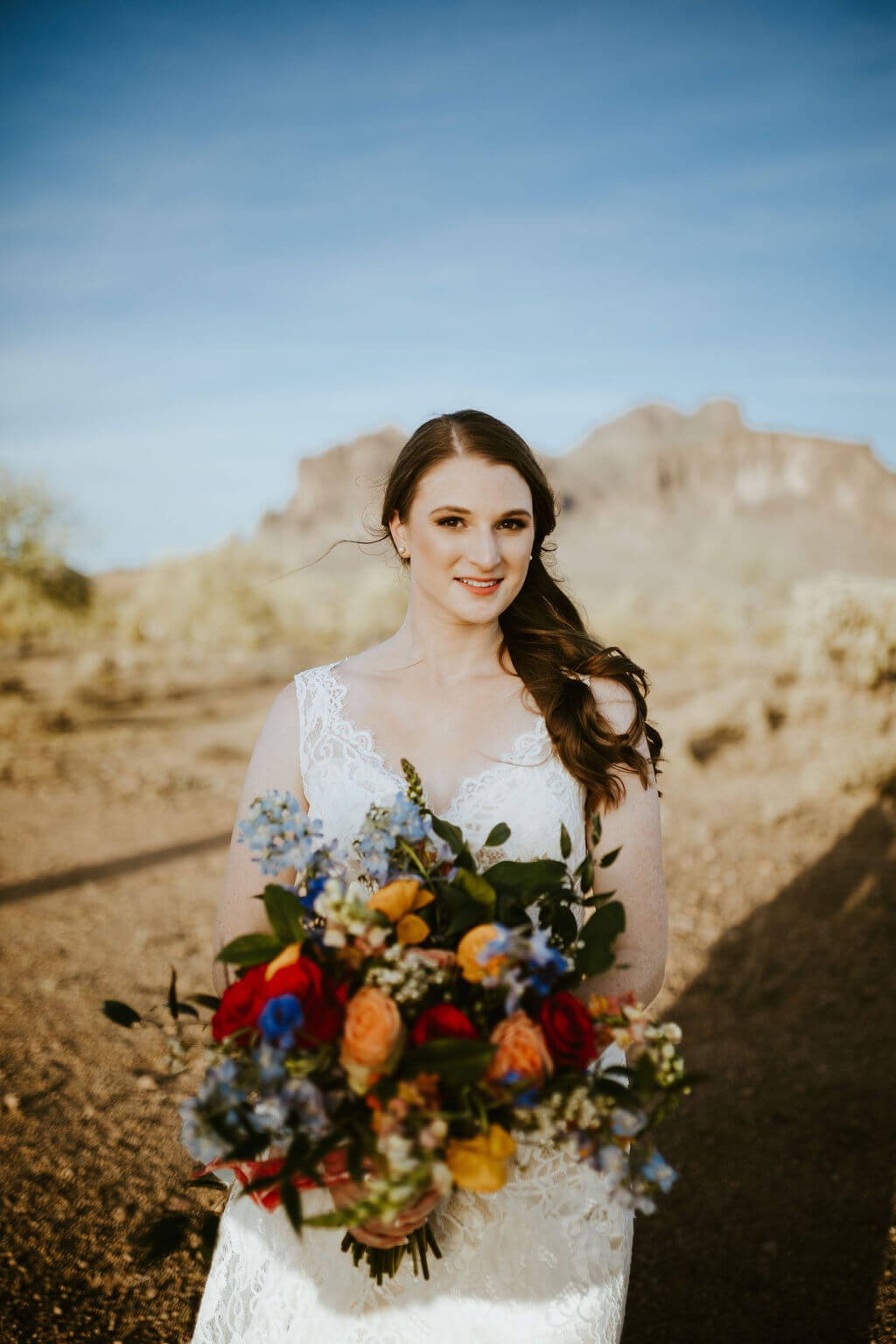 Bride holding bouquet in the desert