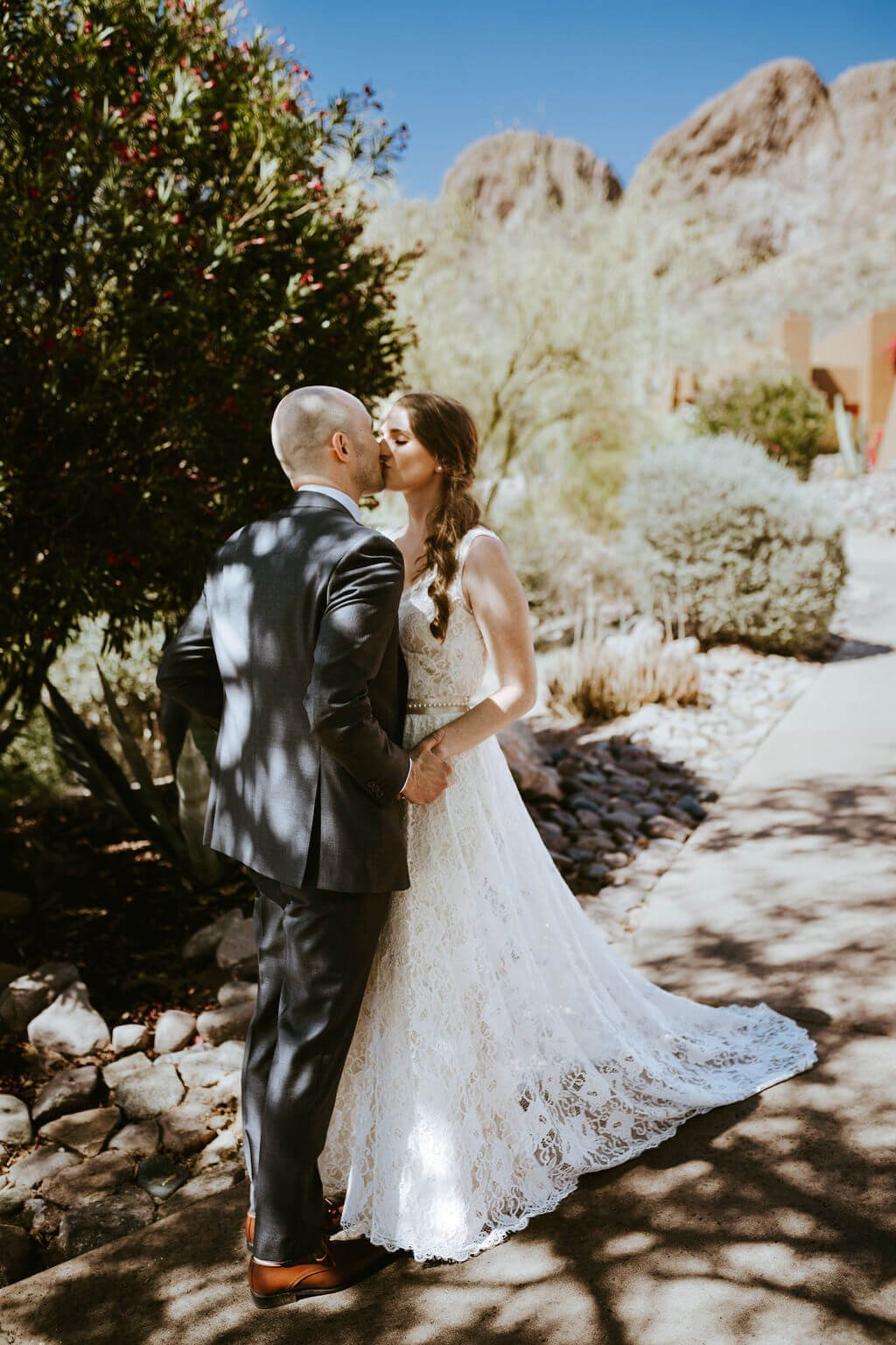 Bride and groom kissing in the Arizona desert