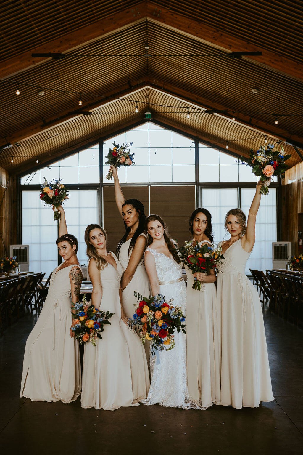 Bridesmaids holding floral bouquets at The Paseo in Arizona