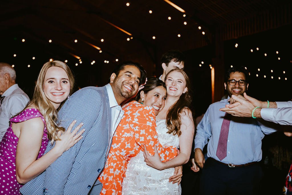 Guests hug bride at Arizona desert wedding reception