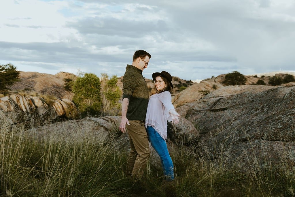 Couple chest bumps during engagement photos in Prescott, Arizona