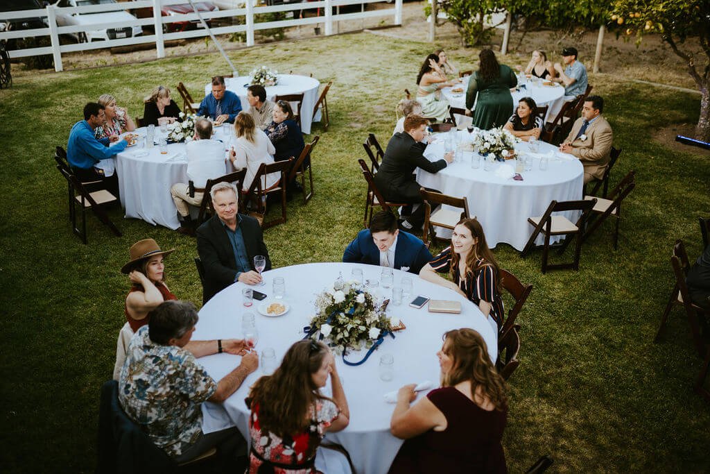 Guests enjoying a backyard wedding reception in Southern California