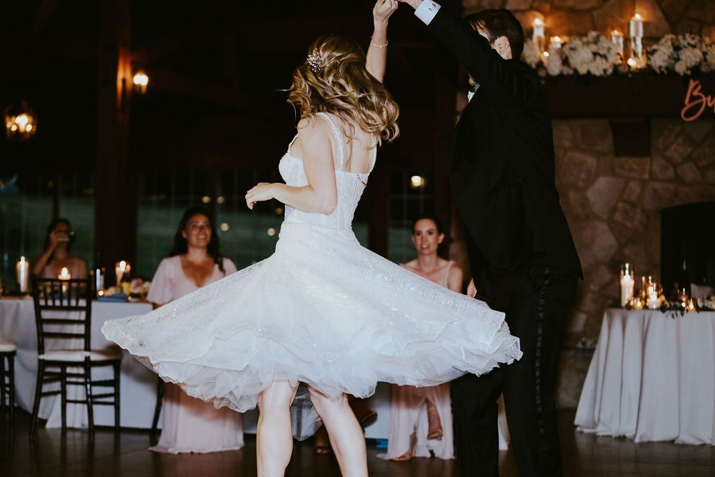 Bride and groom custom choreographed first dance at Orchard Ridge Farms wedding