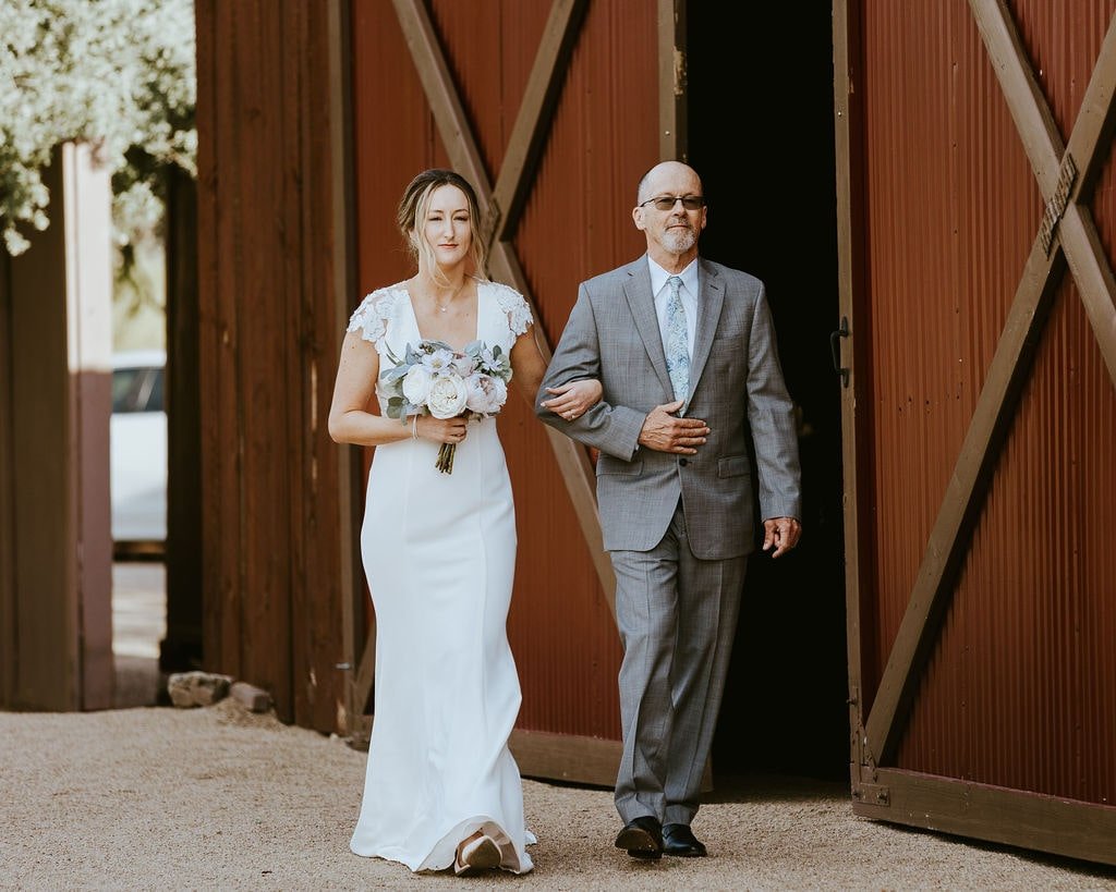 Bride walks down the aisle at Desert Foothills Events wedding venue in Arizona