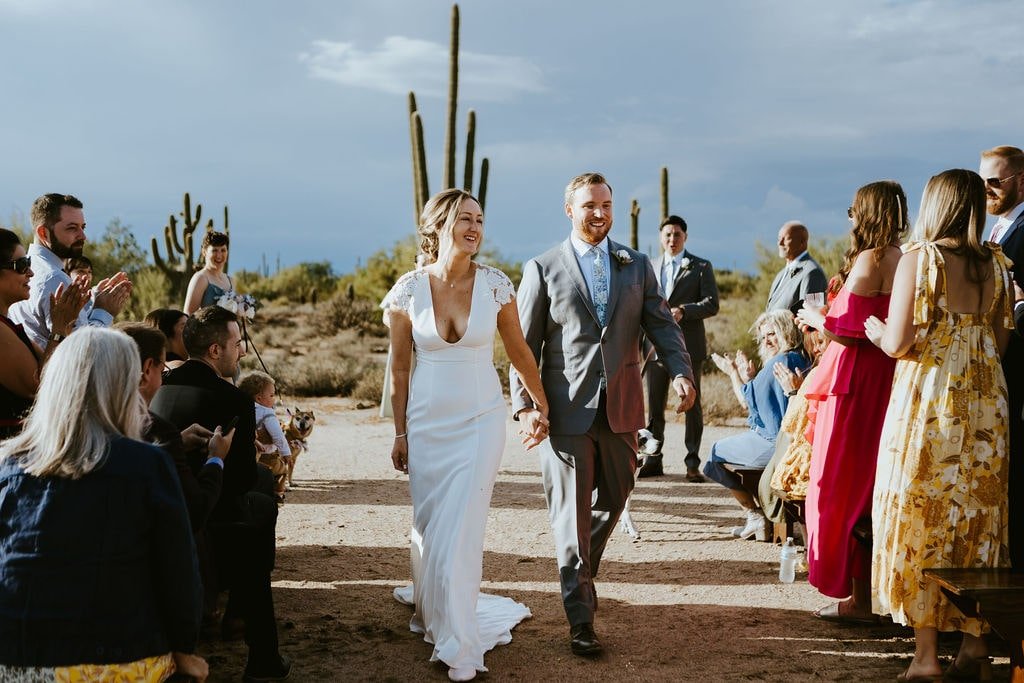 Bride and groom exit their outdoor wedding ceremony at Desert Foothills events