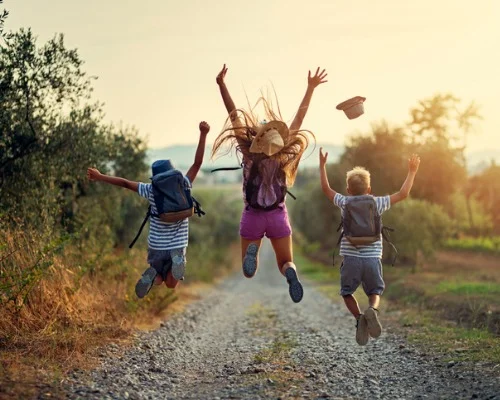 happy-little-hikers-jumping-with-joy-picture-id1090918668.jpg