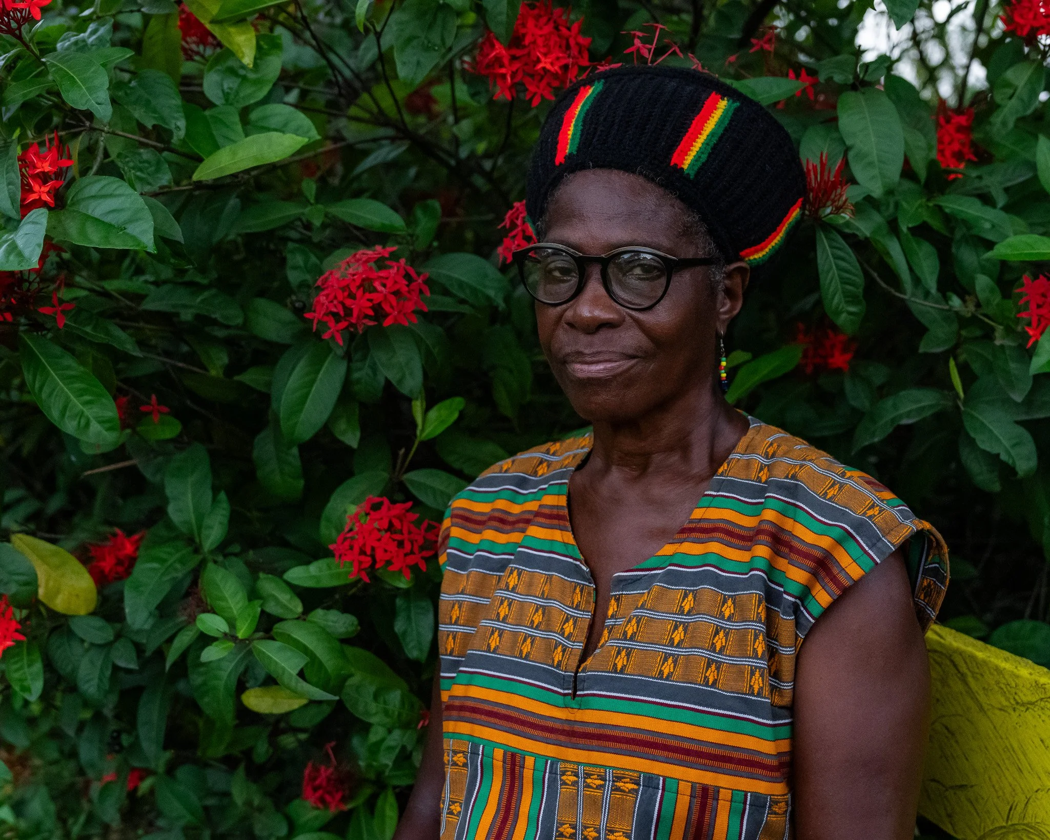 Pamela “Sistah Nanny” Rowe-Williams, Secretary of the Rastafari Coral Gardens Benevolent Society, photographed outdoors in Jamaica.