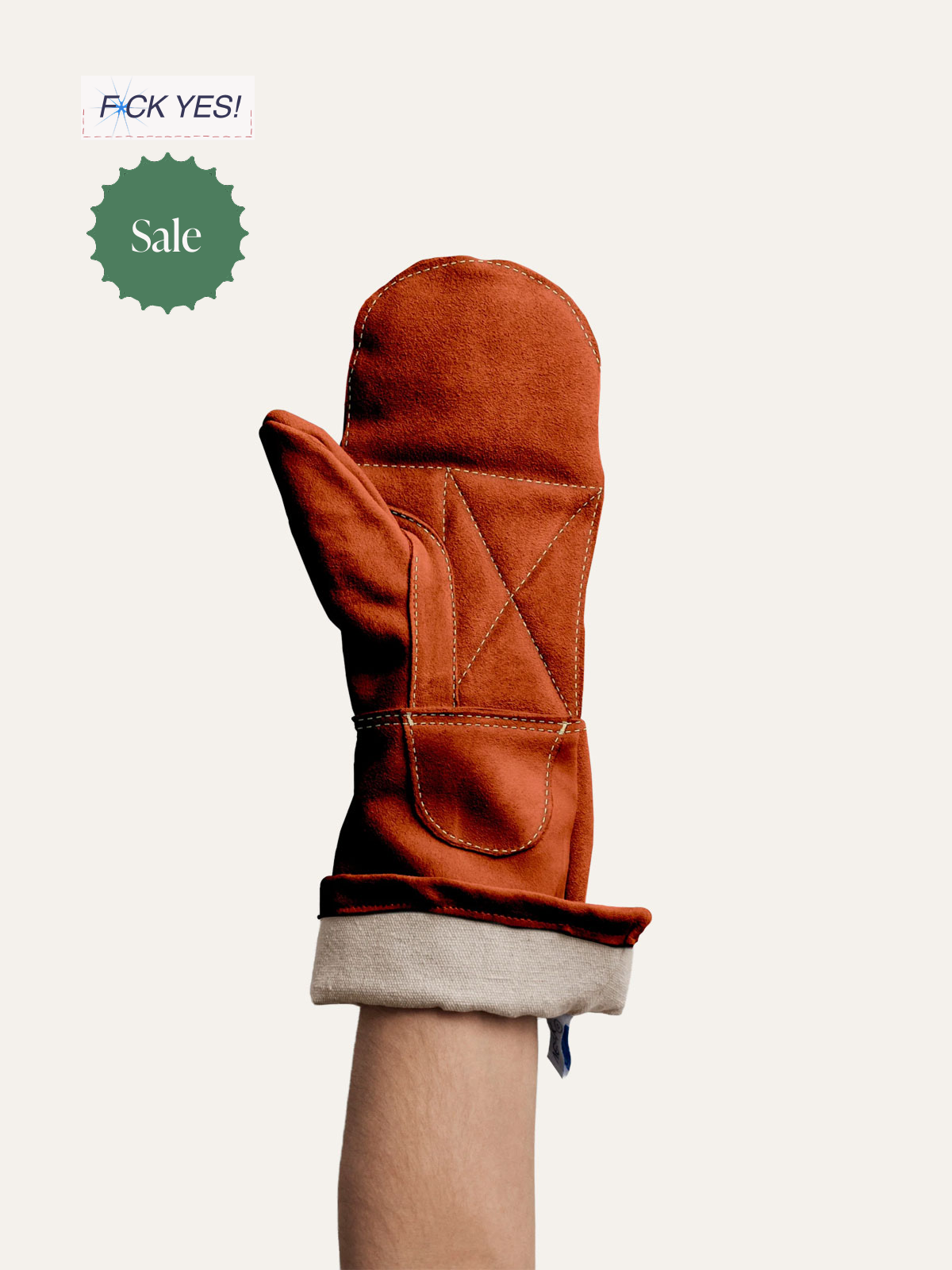A person's arm wearing a red oven mitt with white stitching, raised against a plain background, with sale and bold text labels in the top left corner.