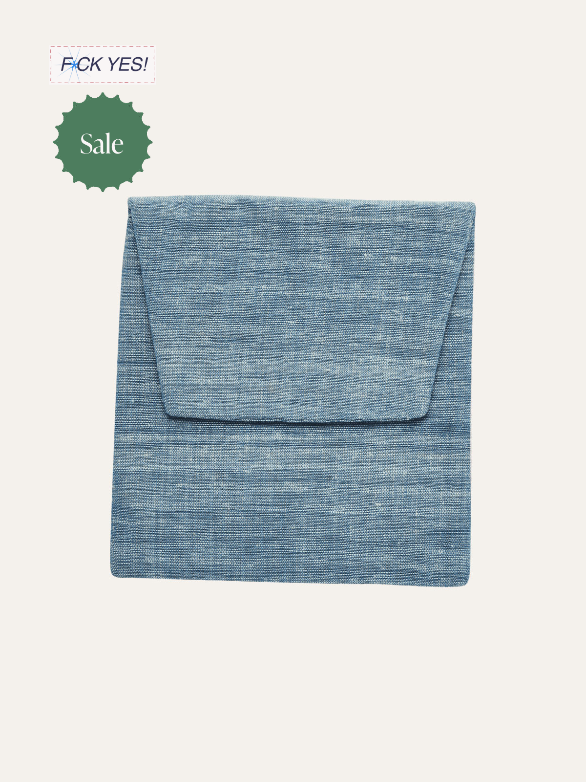 Blue folded fabric with a matching flap, likely a bedsheet or blanket, on a light background. Sale sign and discount sticker with
